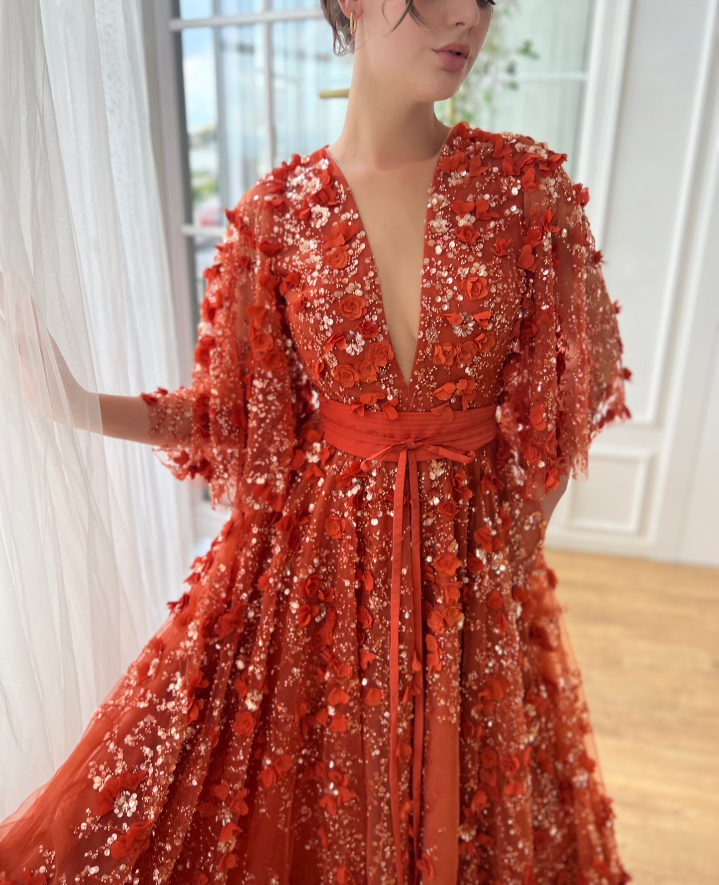 Orange a-line dress with flutter sleeves, v-neck and embroidery