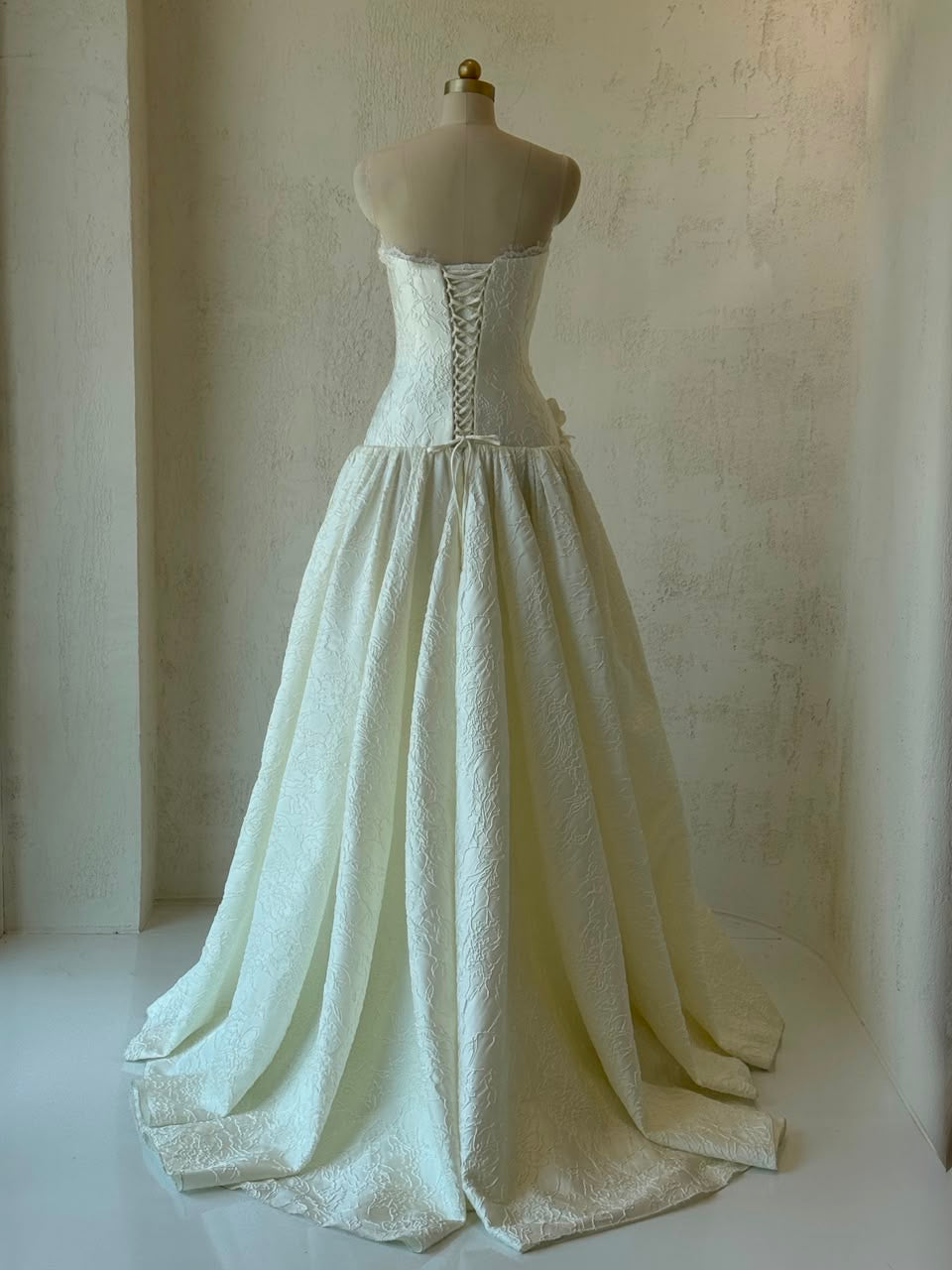 White A-Line gown with embroidery and no sleeves