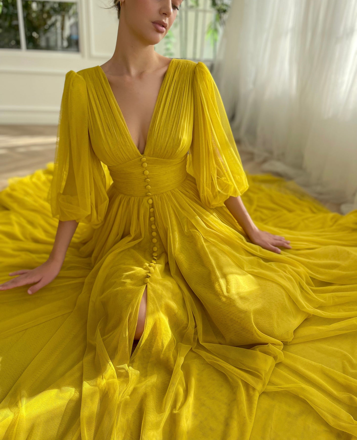 Yellow A-Line dress with long sleeves and v-neck