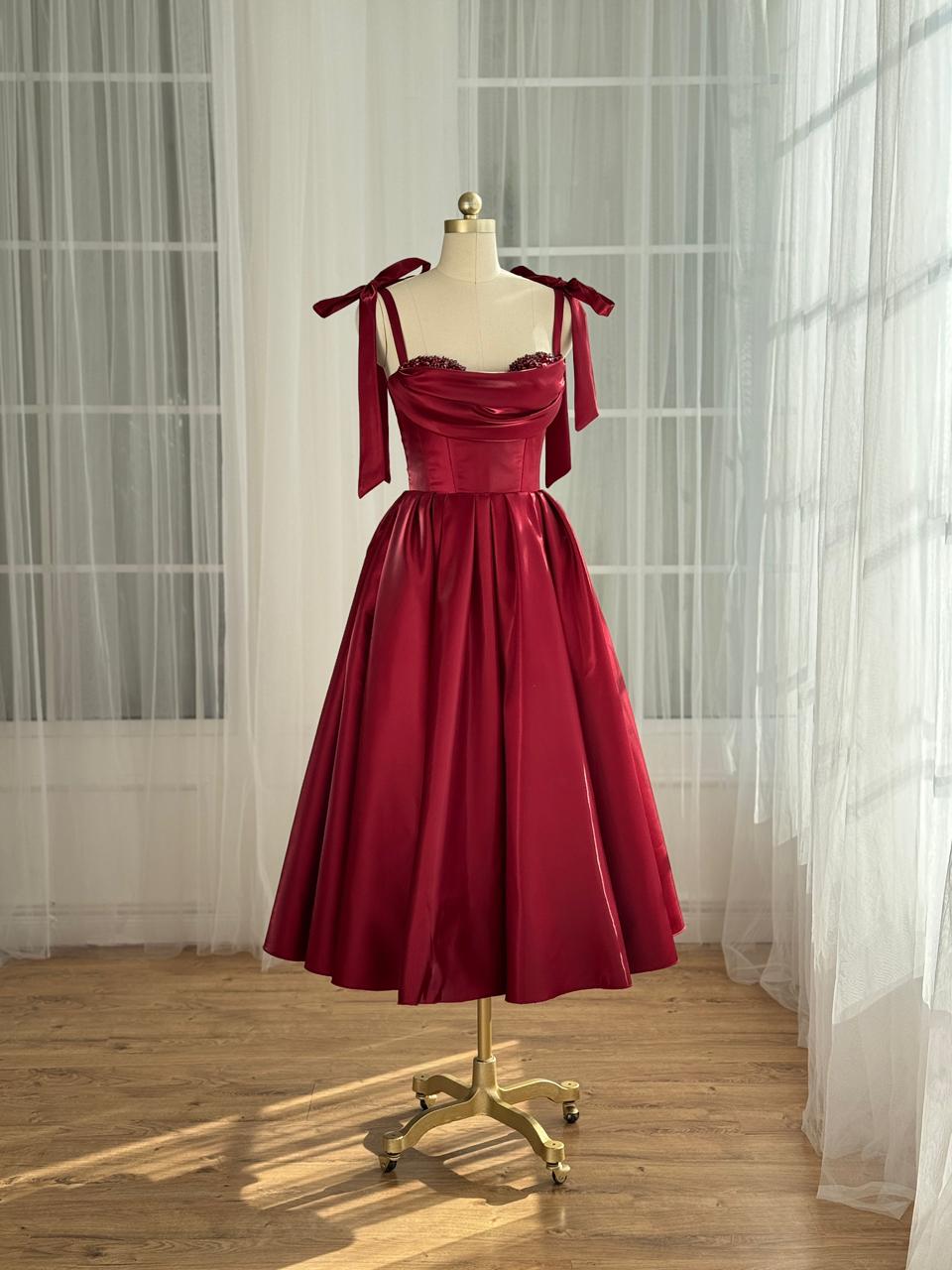 Red midi dress with bow straps and beaded trim