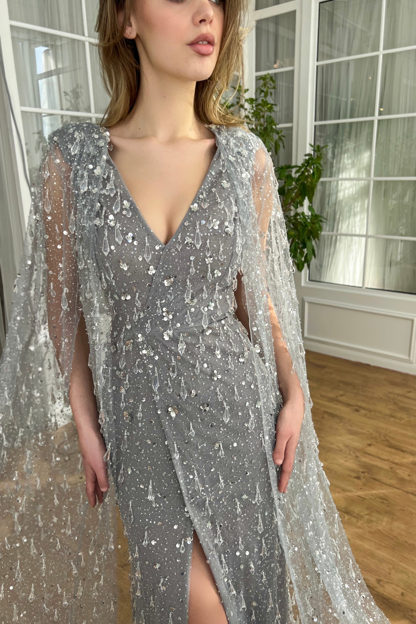 Grey mermaid dress with v-neck, cape and embroidered crystals