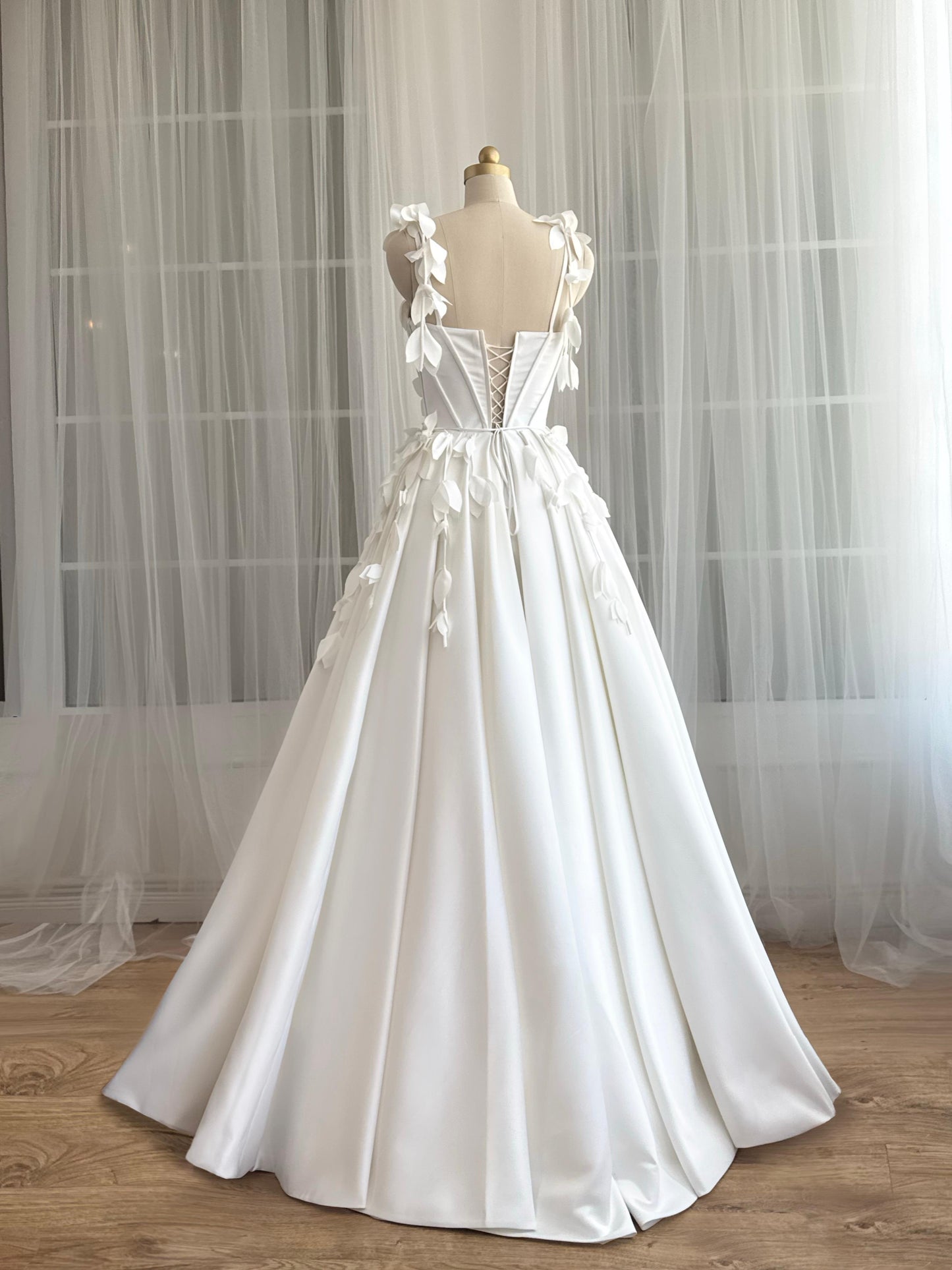 White bridal A-Line gown with straps and embroidered petals