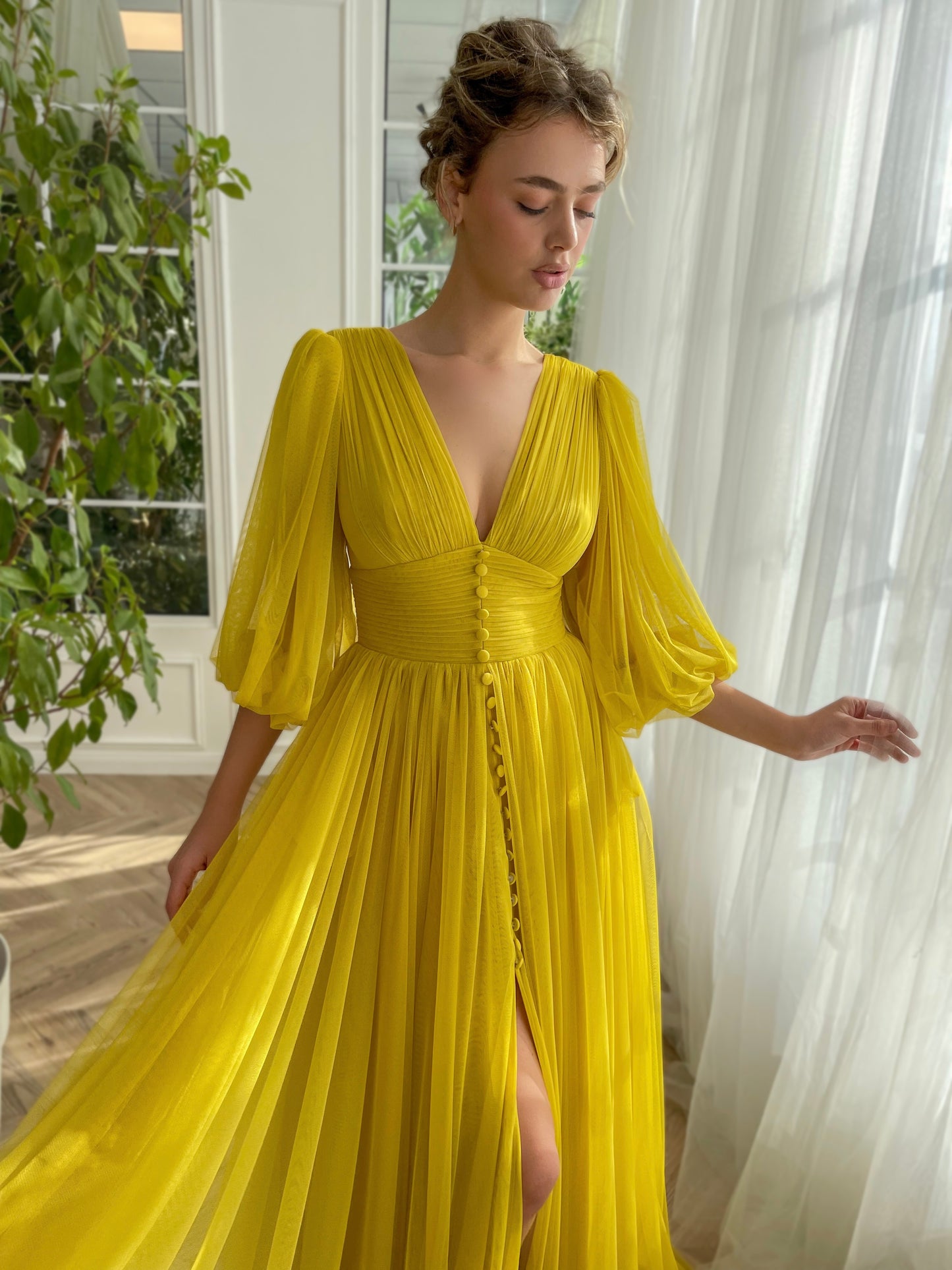 Yellow A-Line dress with long sleeves and v-neck