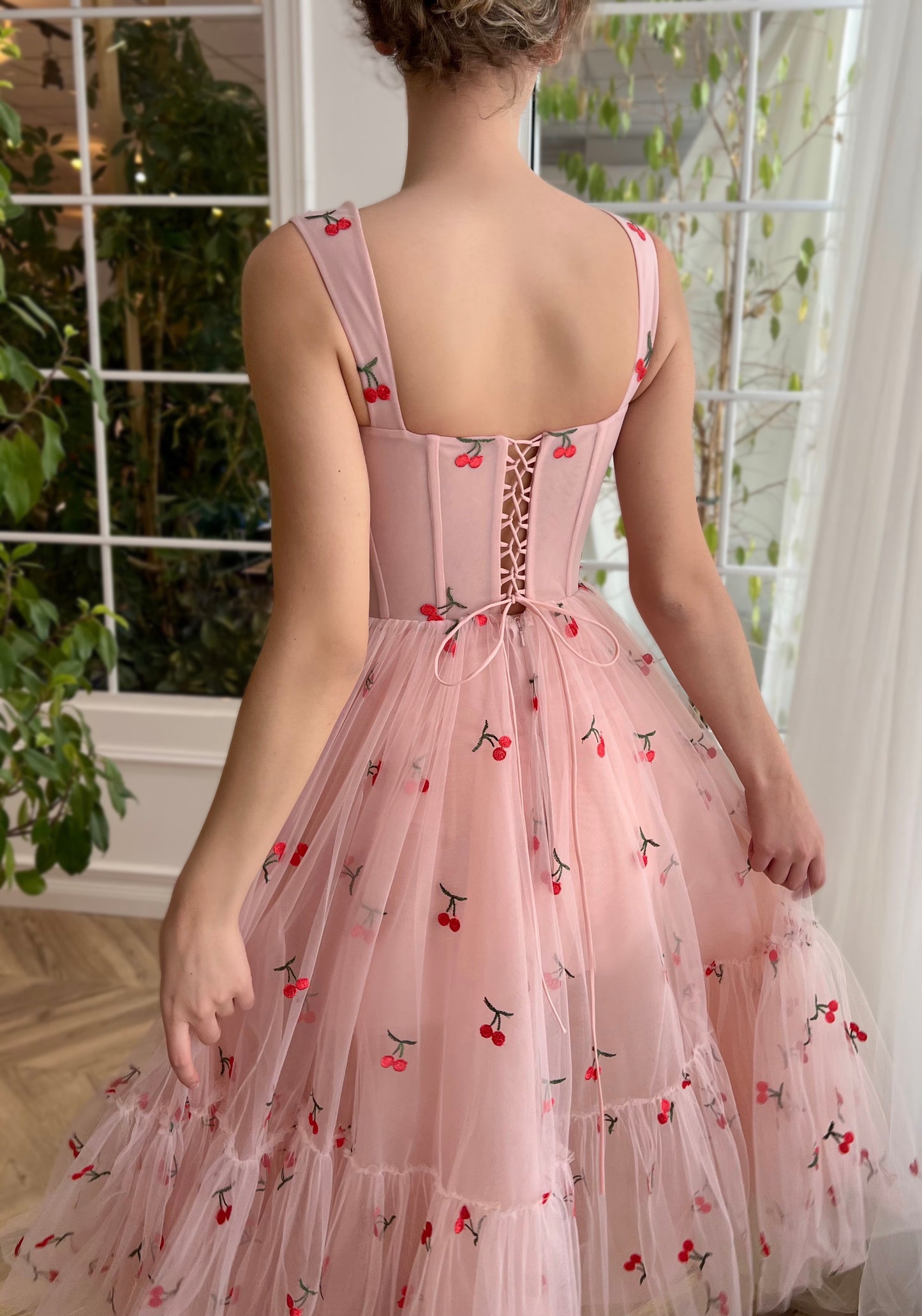 Pink midi dress with printed cherries and straps