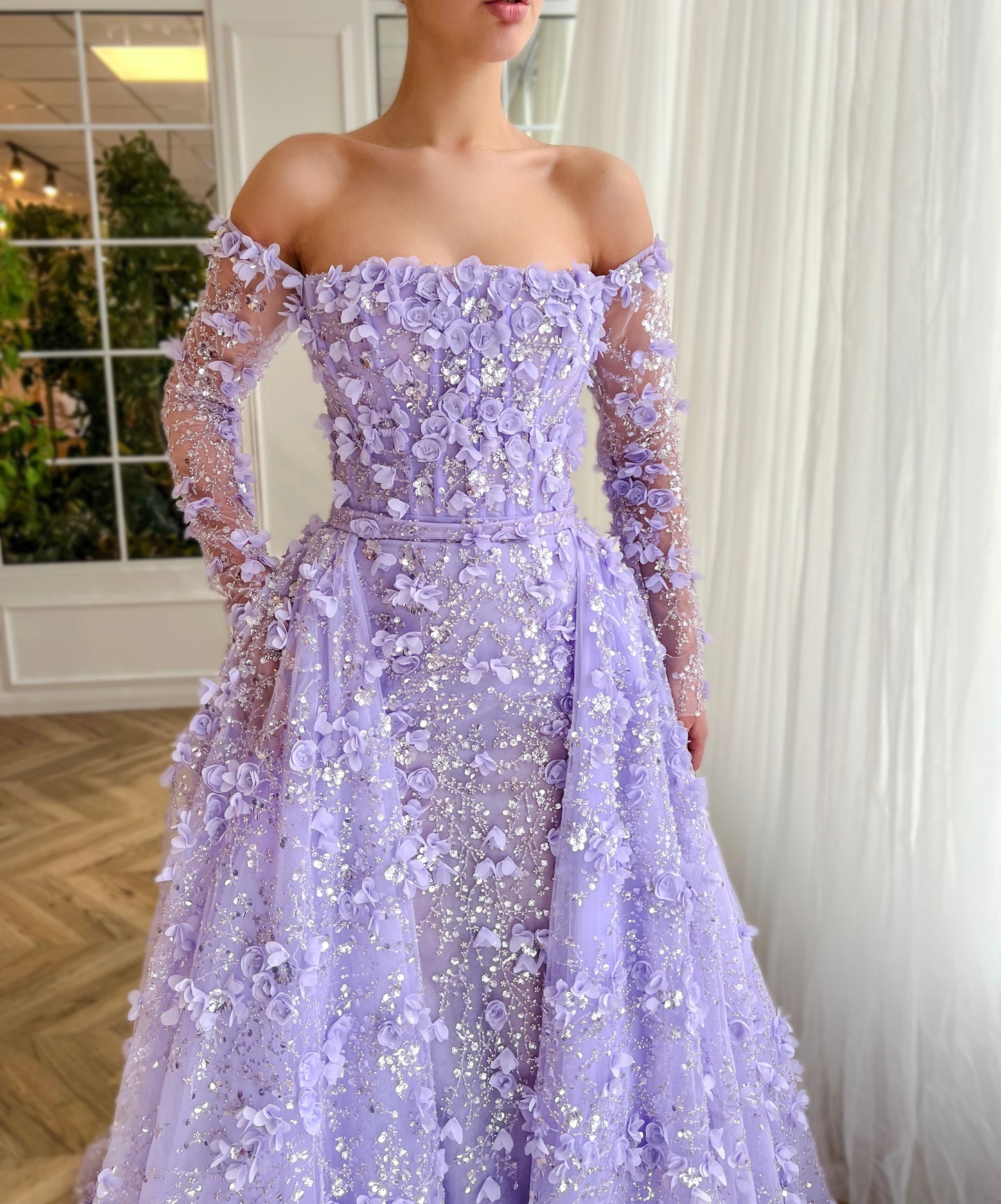 Purple overskirt dress with long off the shoulder sleeves and embroidered flowers