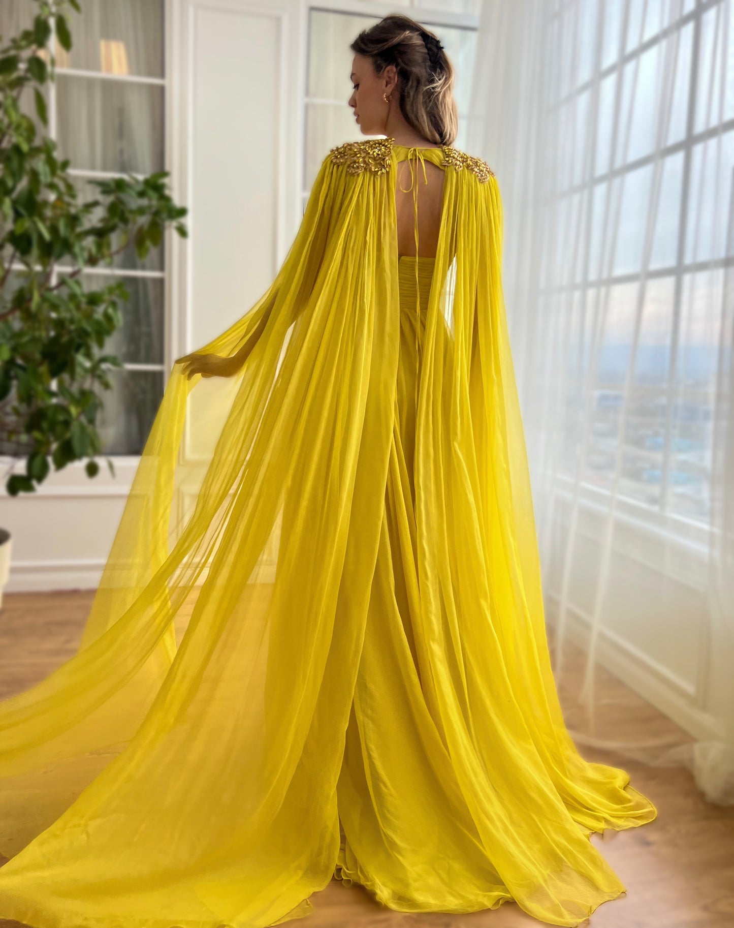 Yellow A-Line dress with embroidery and cape sleeves