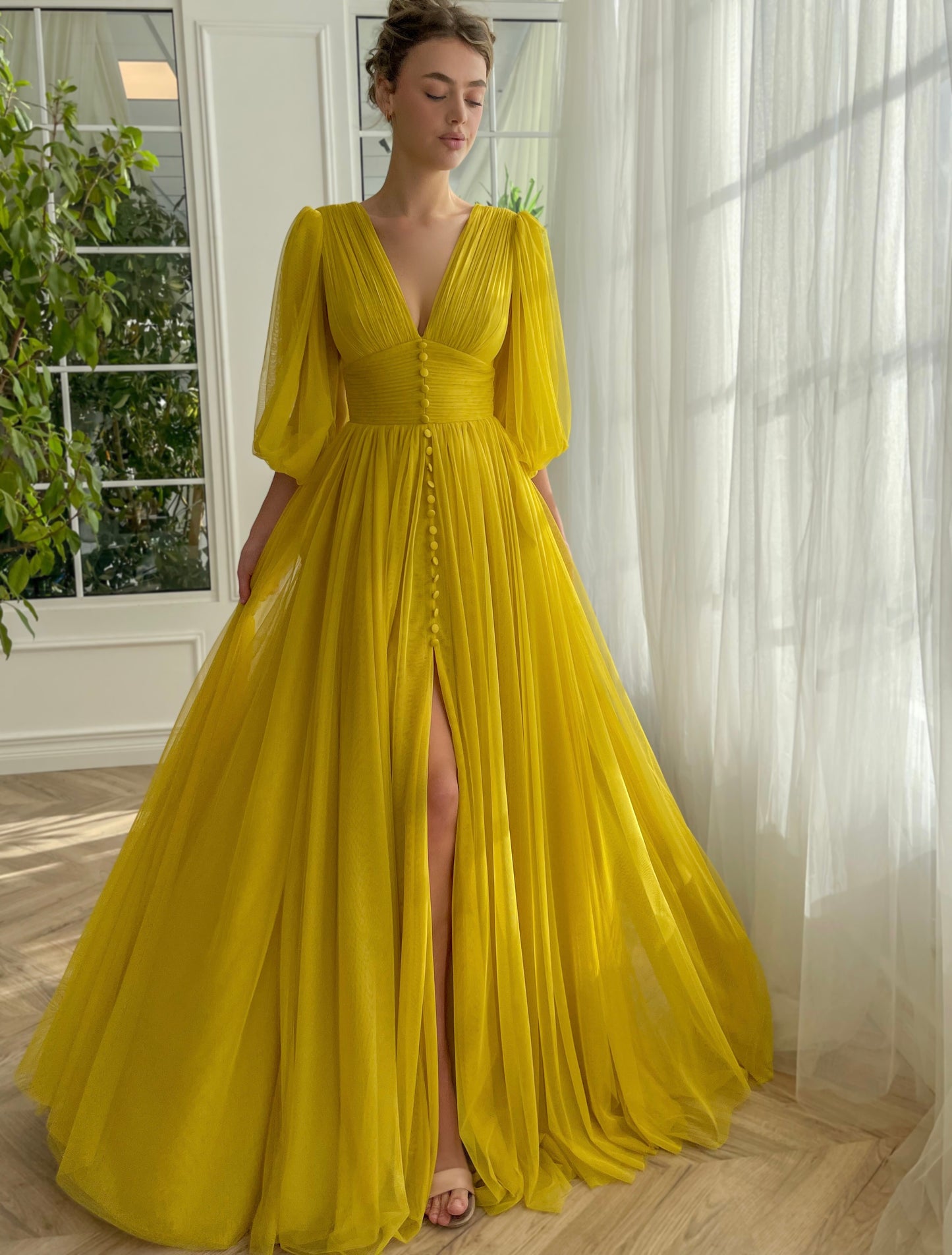 Yellow A-Line dress with long sleeves and v-neck