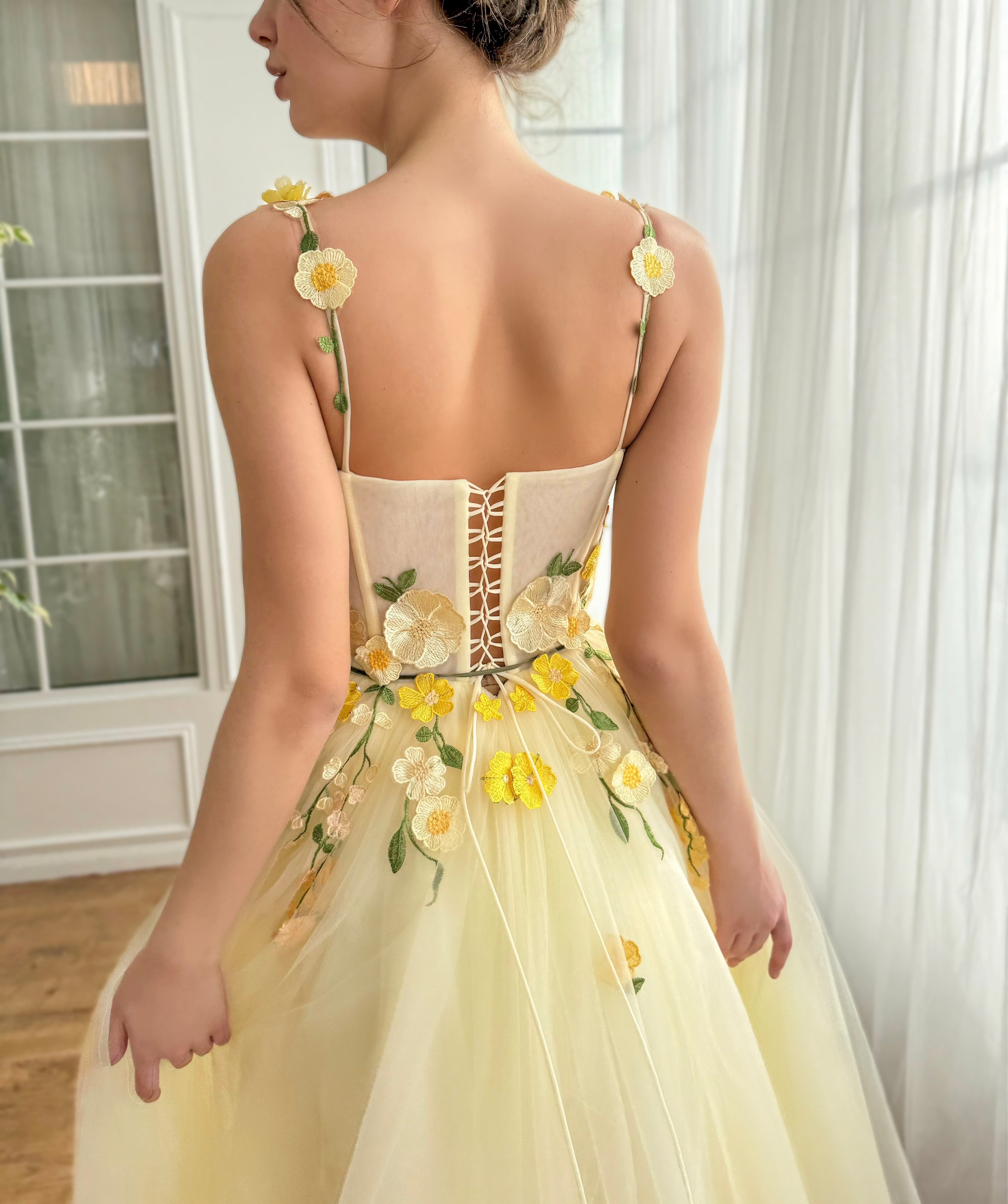 Yellow midi dress with straps and embroidered flowers