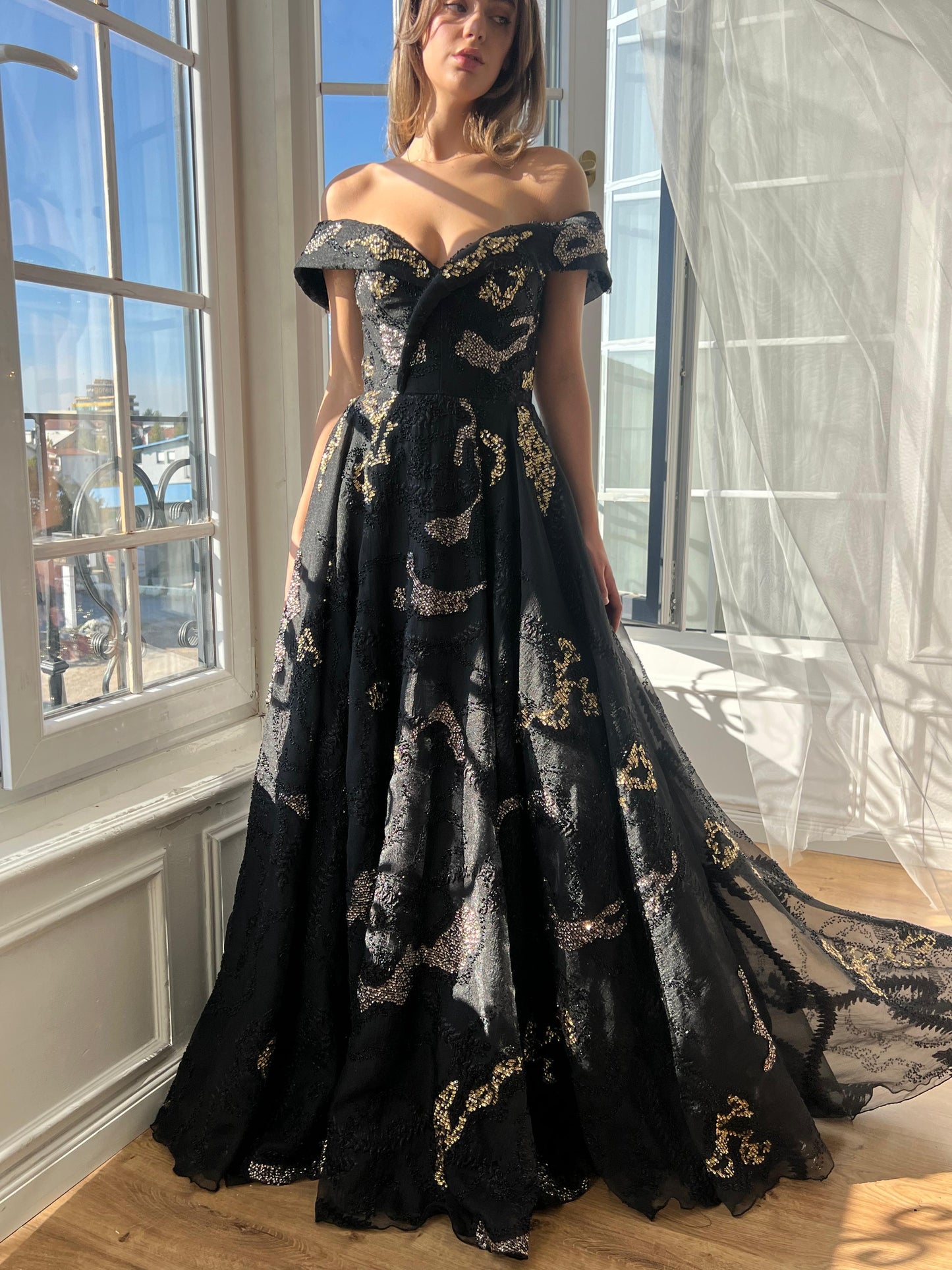 Black A-Line dress with off the shoulder sleeves, brocade fabric and embroidery