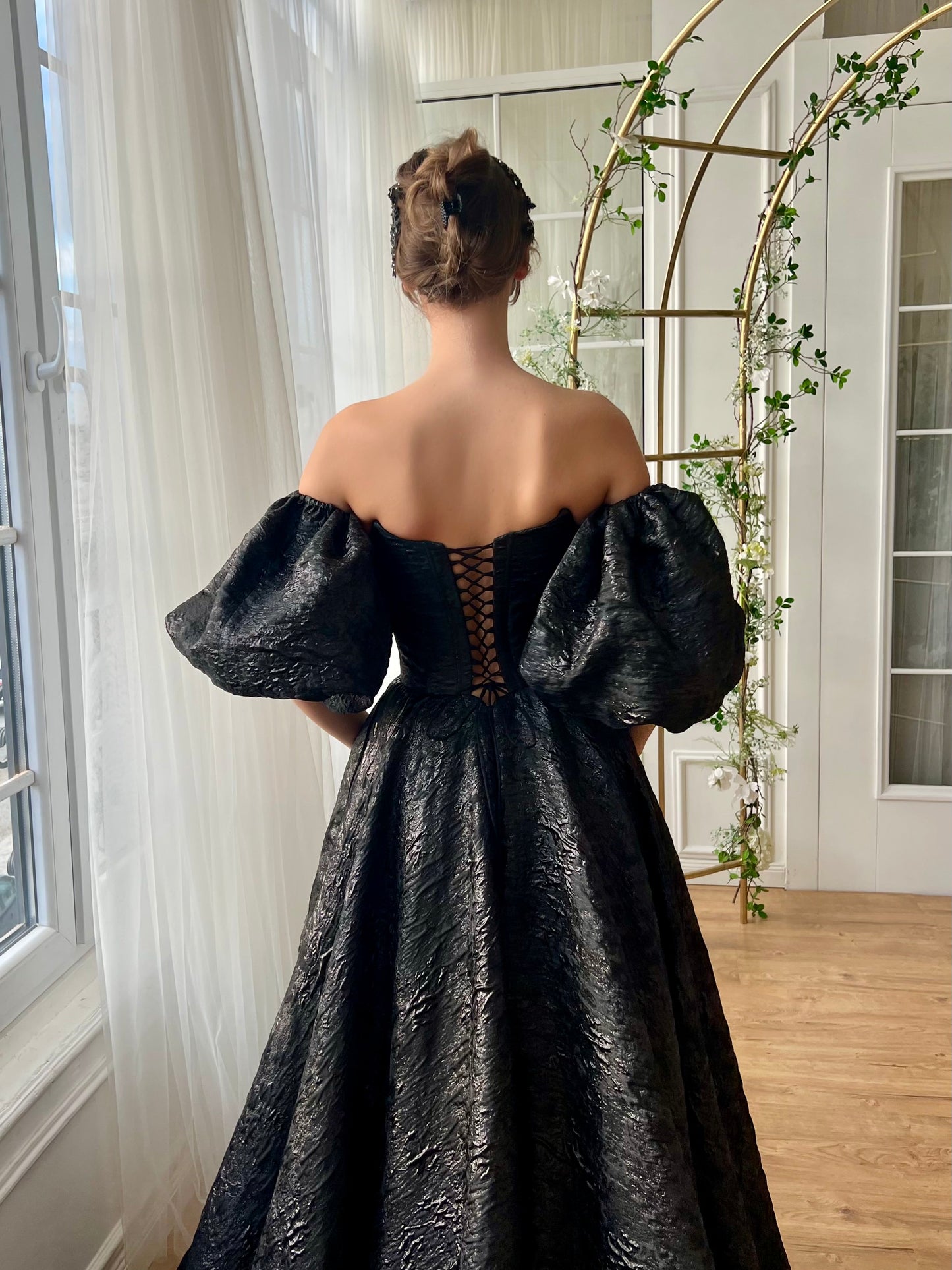 Black A-Line gown with short off the shoulder sleeves and brocade fabric