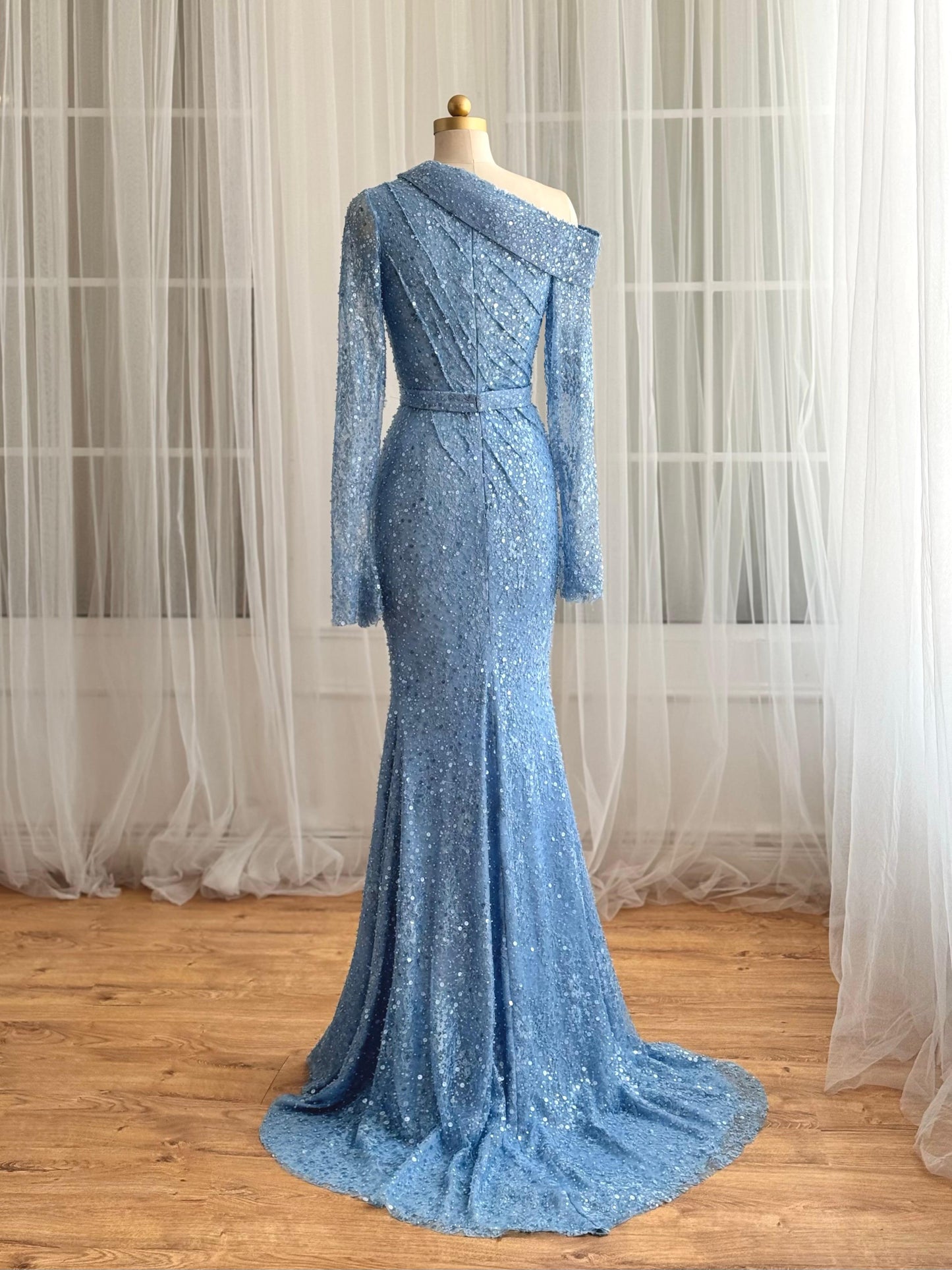 Blue mermaid dress with long sleeves and sequin fabric