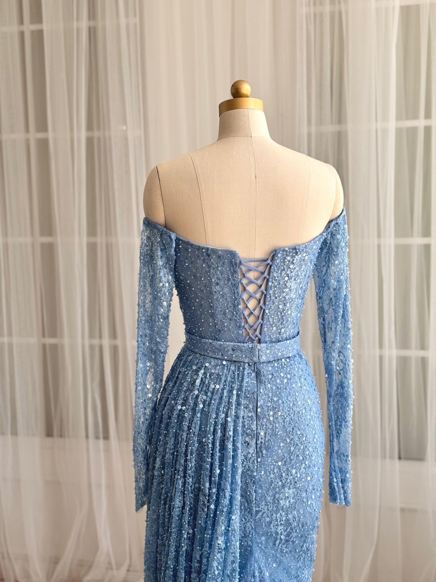 Blue mermaid dress with long off the shoulder sleeves and sequin fabric