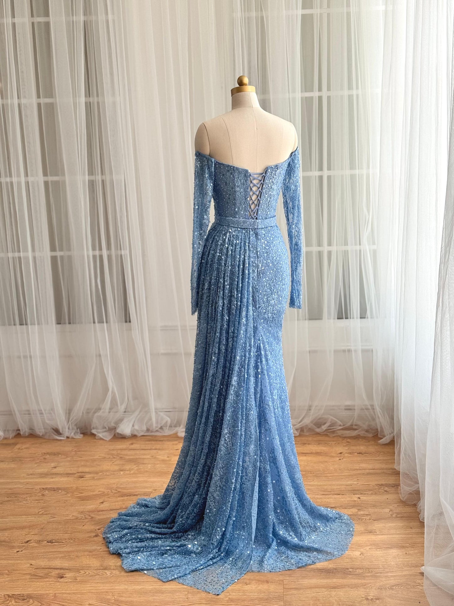 Blue mermaid dress with long off the shoulder sleeves and sequin fabric