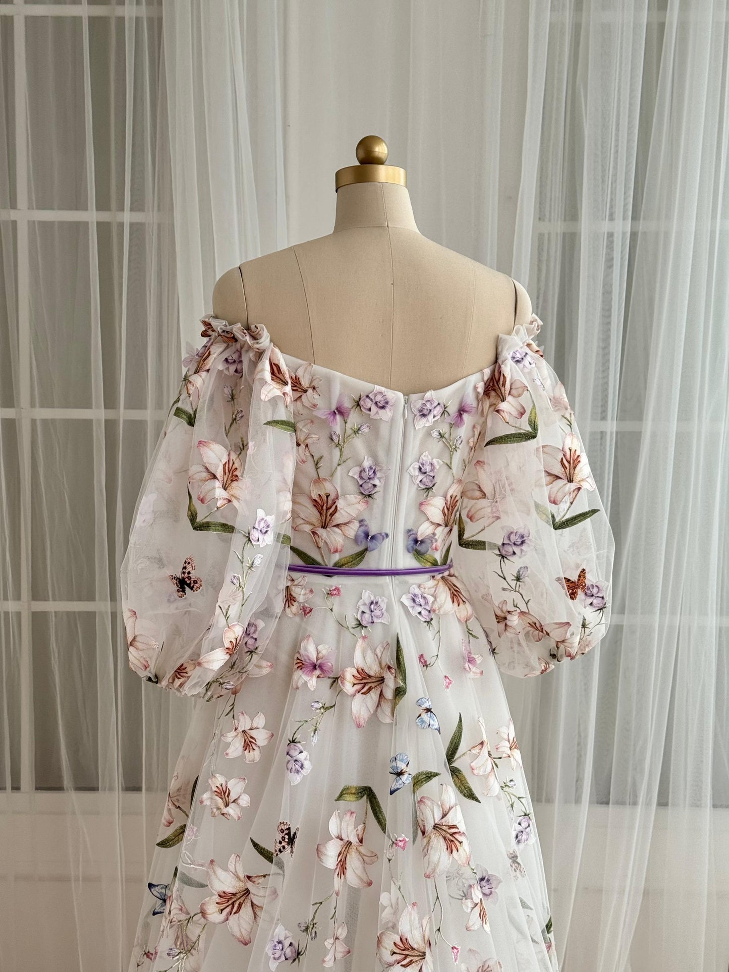 White A-Line dress with floral embroidery and long off the shoulder sleeves