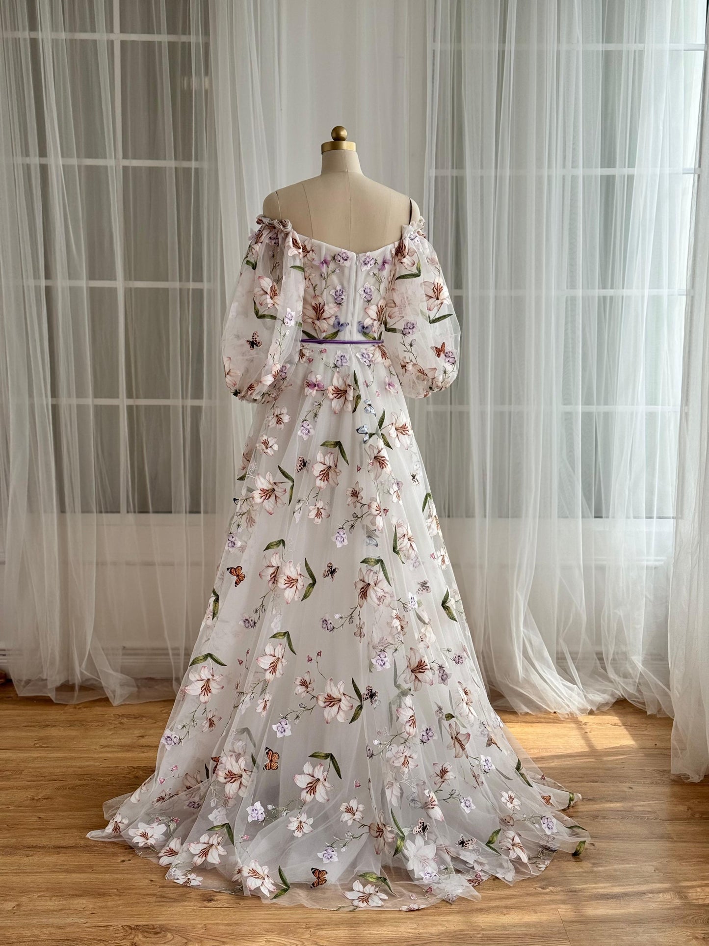 White A-Line dress with floral embroidery and long off the shoulder sleeves