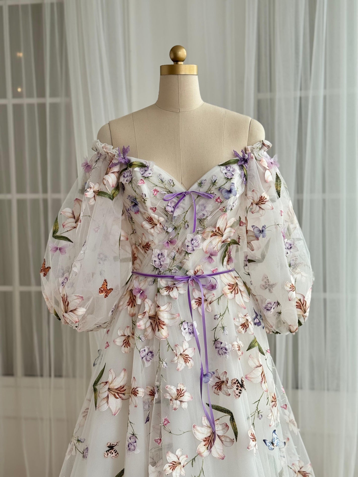 White A-Line dress with floral embroidery and long off the shoulder sleeves