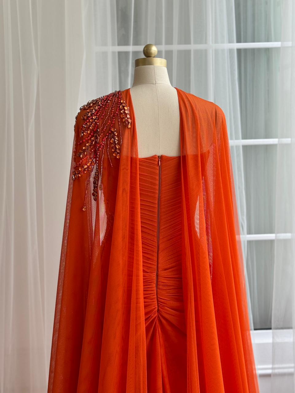 Orange mermaid dress with embroidery, cape and no sleeves