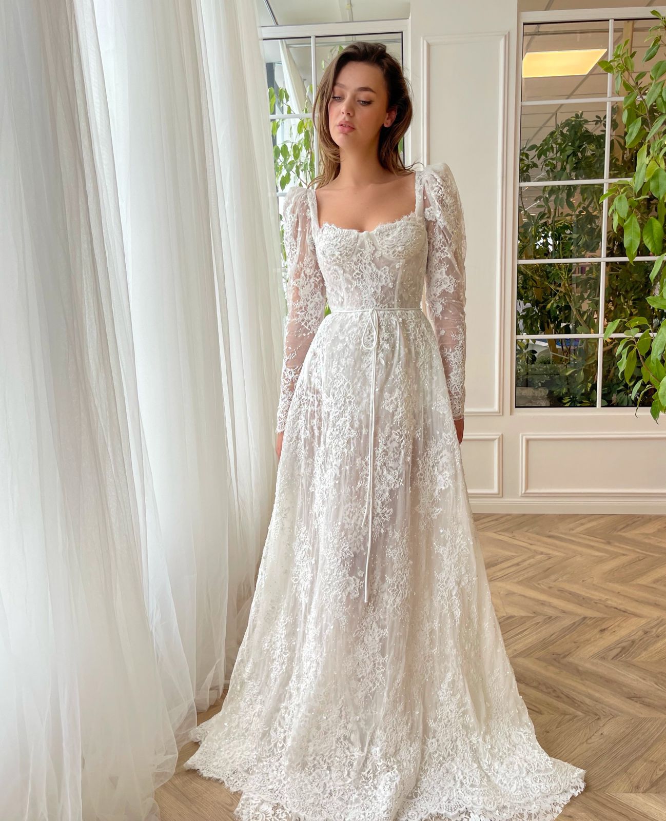 White A-Line bridal dress with long sleeves, lace and embroidery