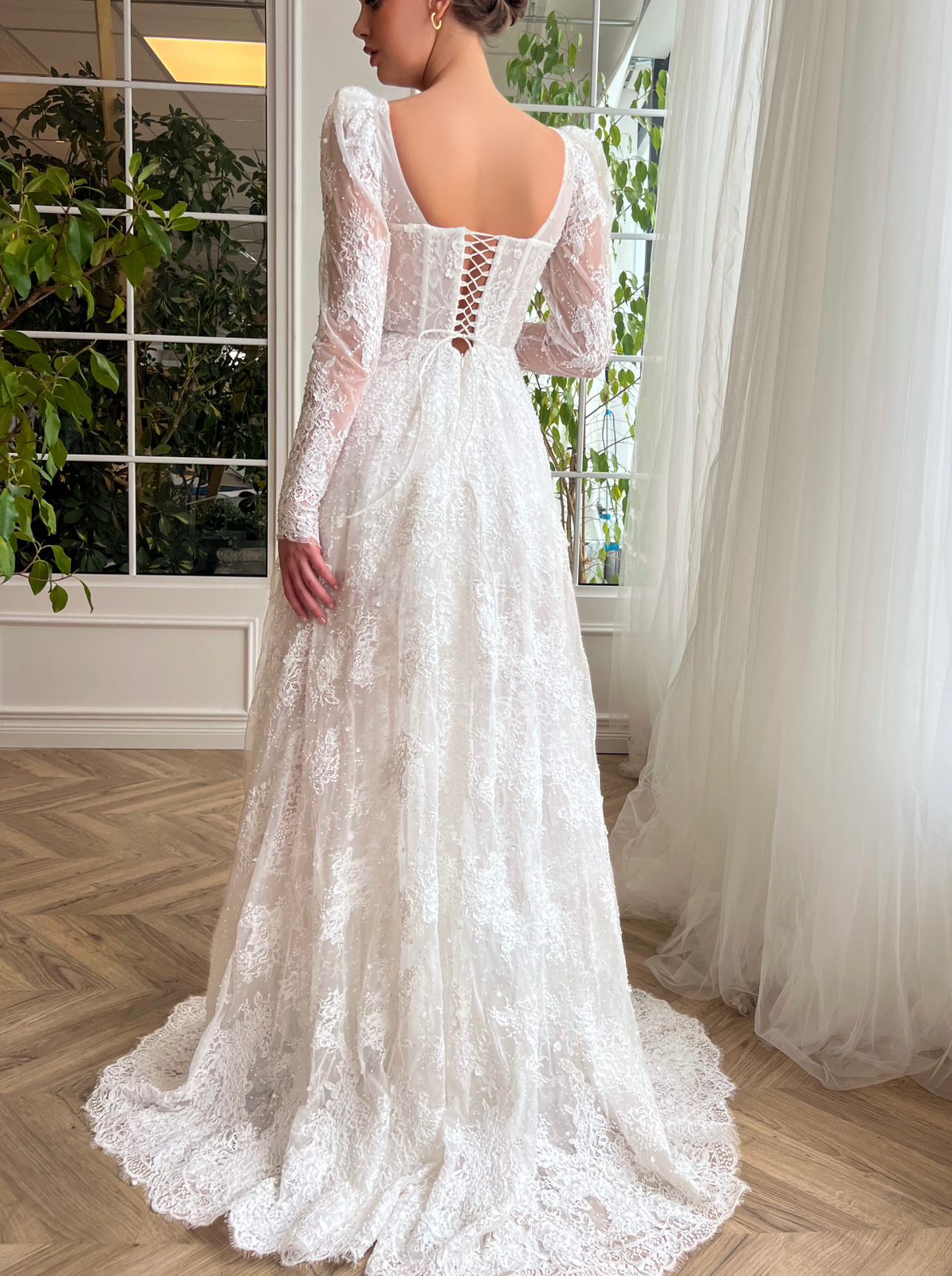 White A-Line bridal dress with long sleeves, lace and embroidery