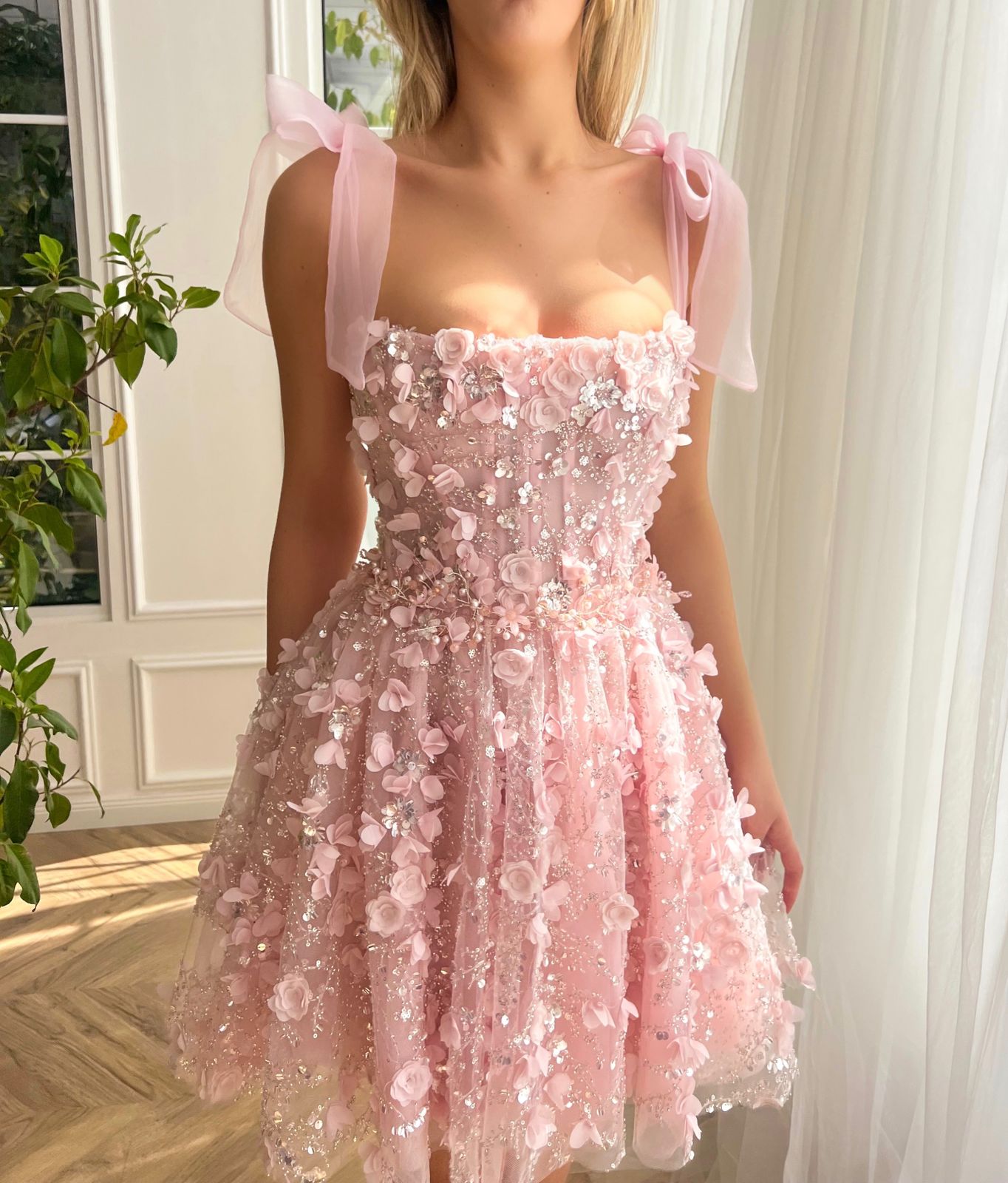 Pink mini dress with bow straps and embroidery