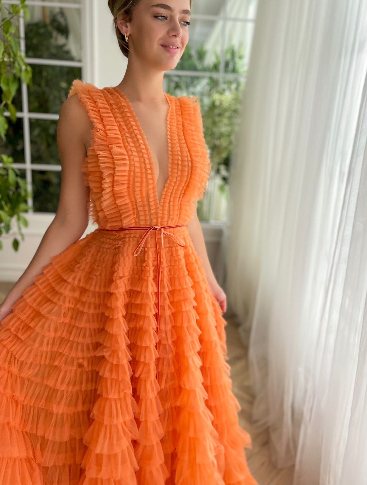 Orange A-Line dress with ruffles, no sleeves and v-neck