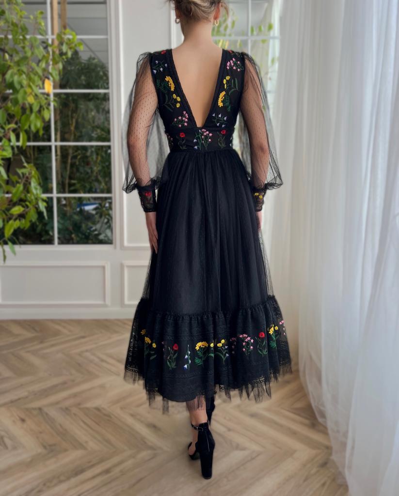black dotted midi dress with v-neck, long sleeves and embroidery
