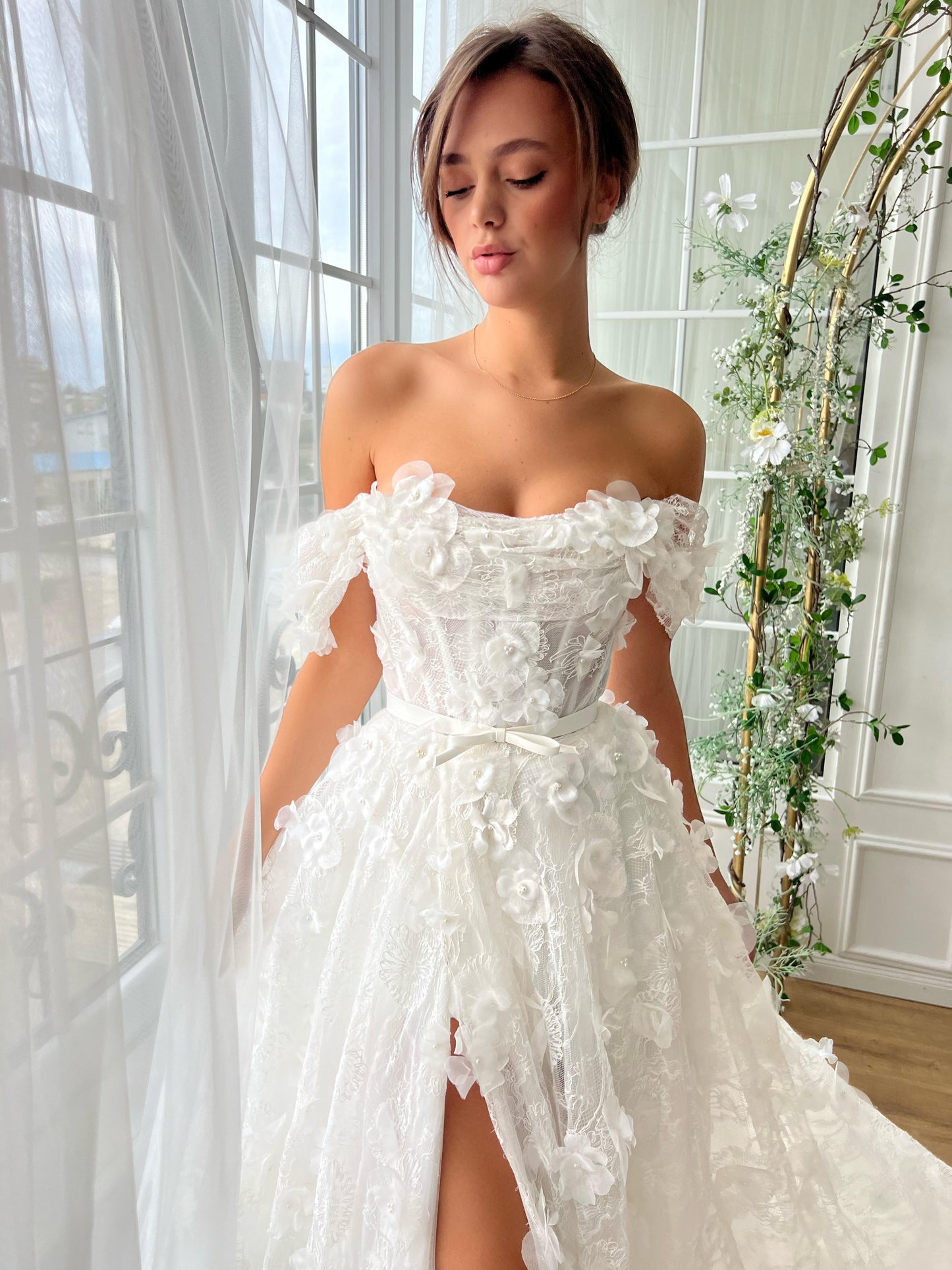 White bridal A-Line gown with off the shoulder sleeves and embroidery