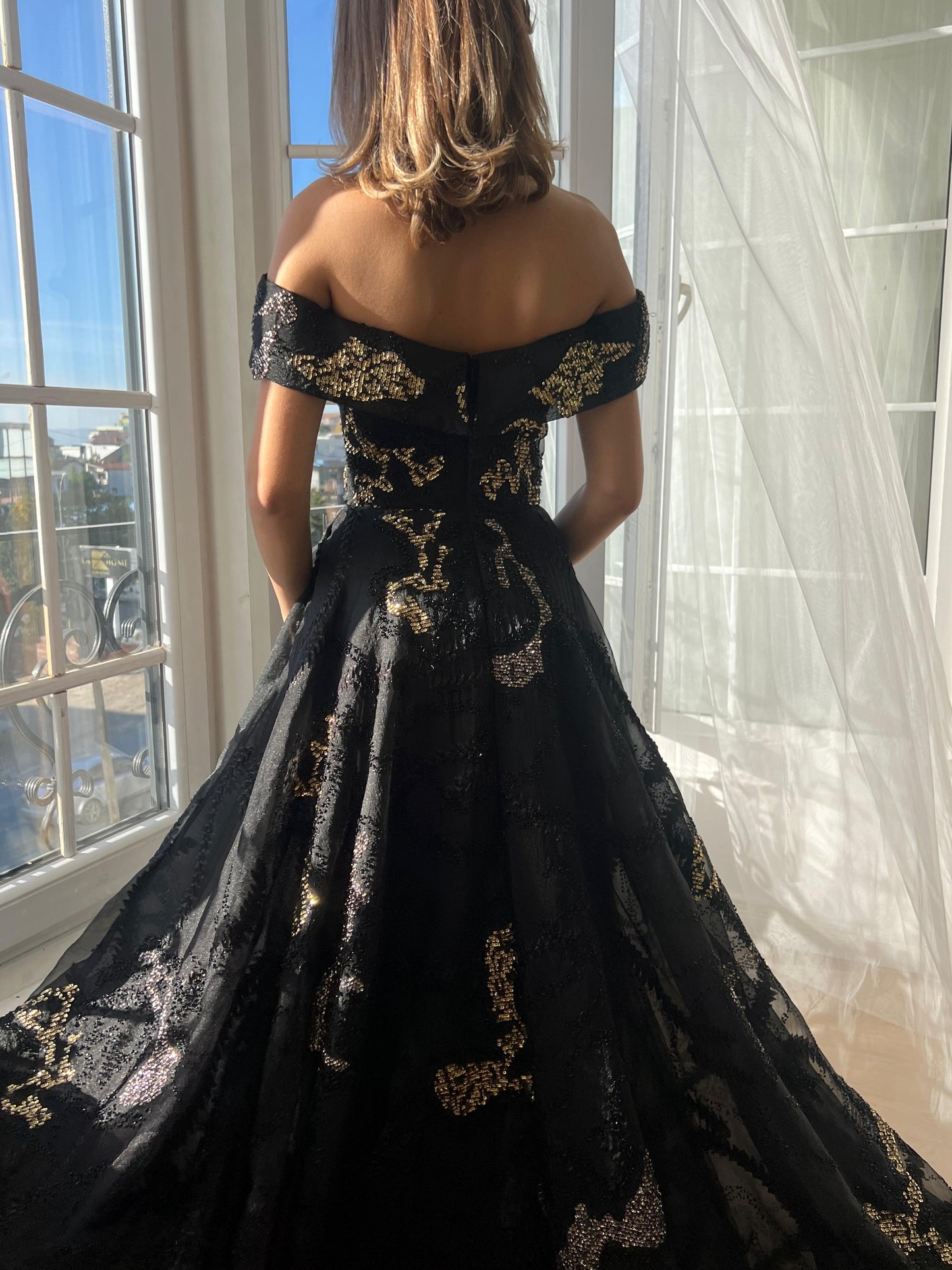 Black A-Line dress with off the shoulder sleeves, brocade fabric and embroidery