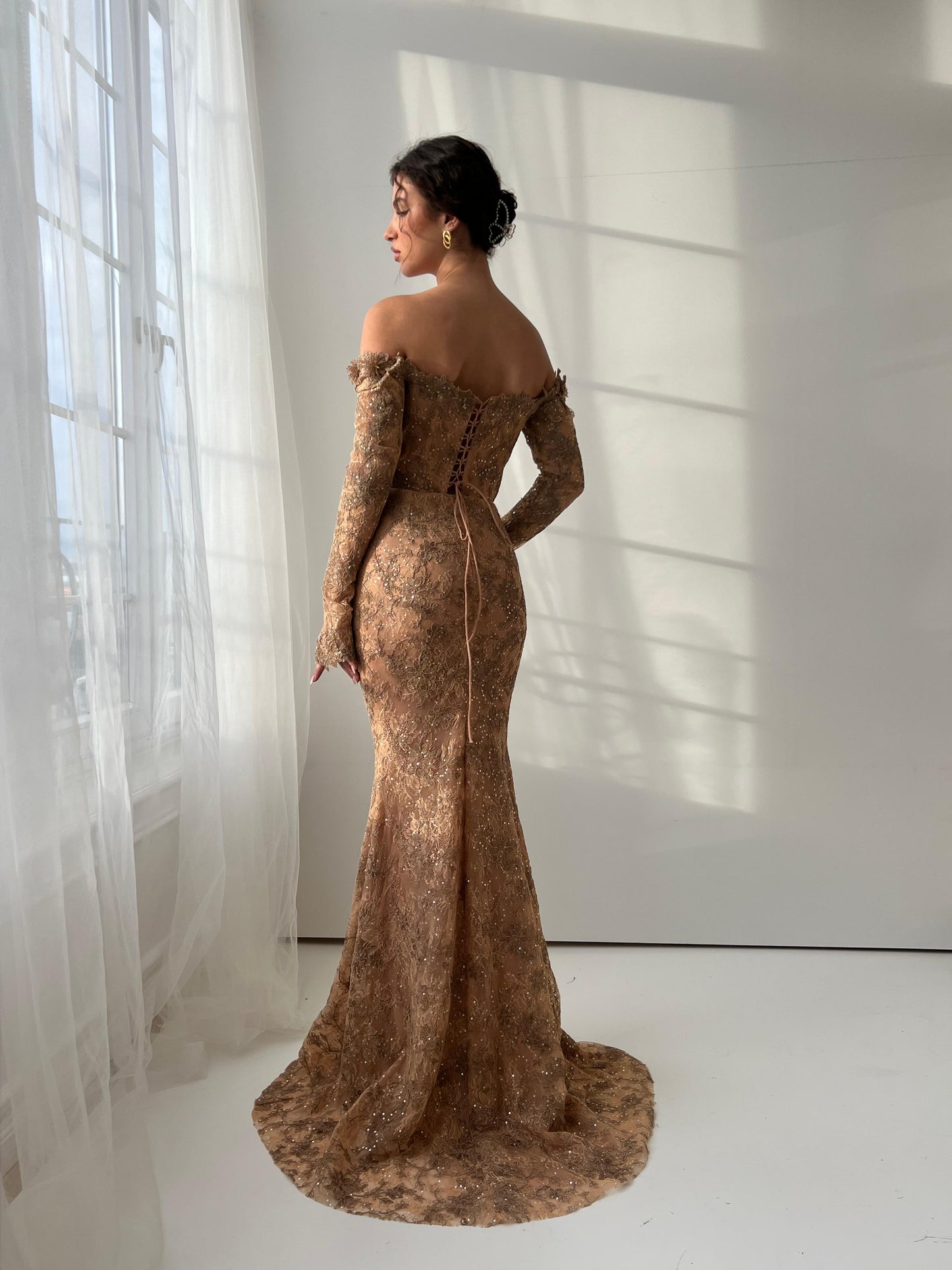 Brown mermaid dress with long off the shoulder sleeves and embroidery
