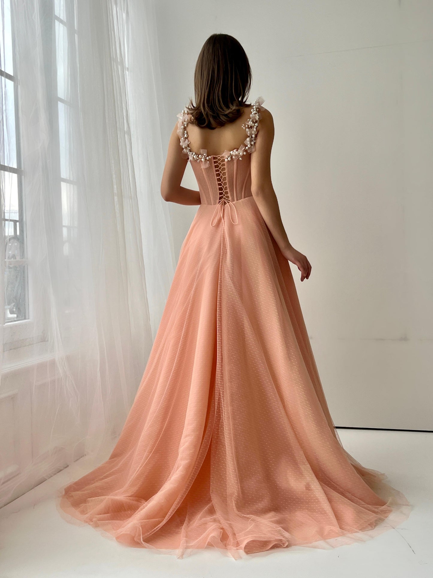 Peach A-Line gown with spaghetti straps and embroidery