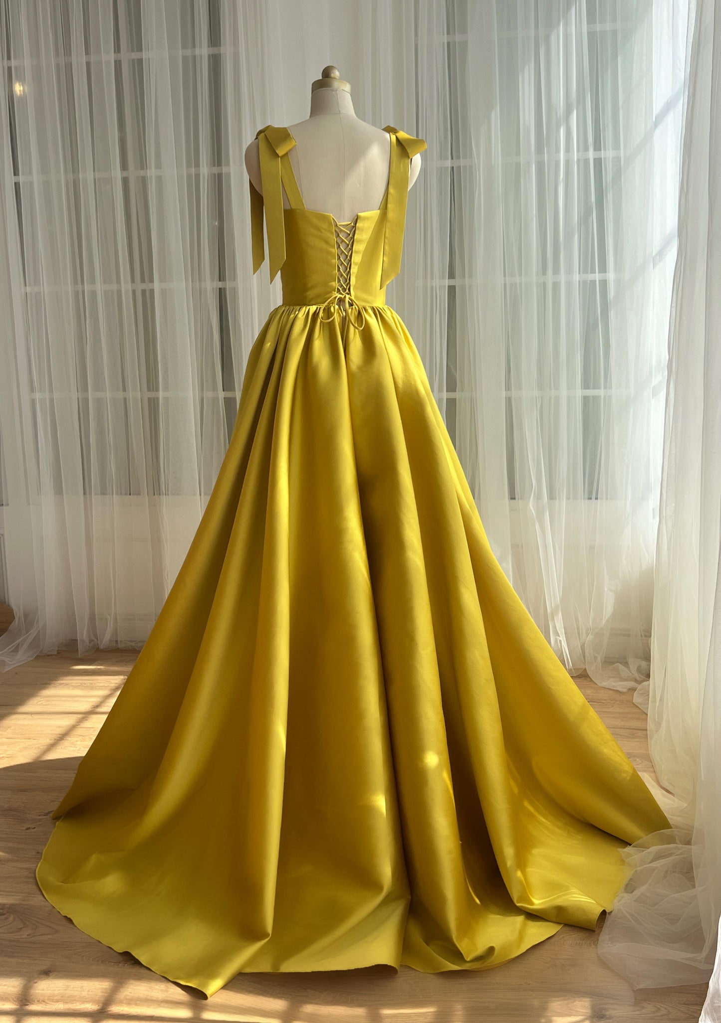 Yellow A-Line dress with bow straps and taffeta fabric