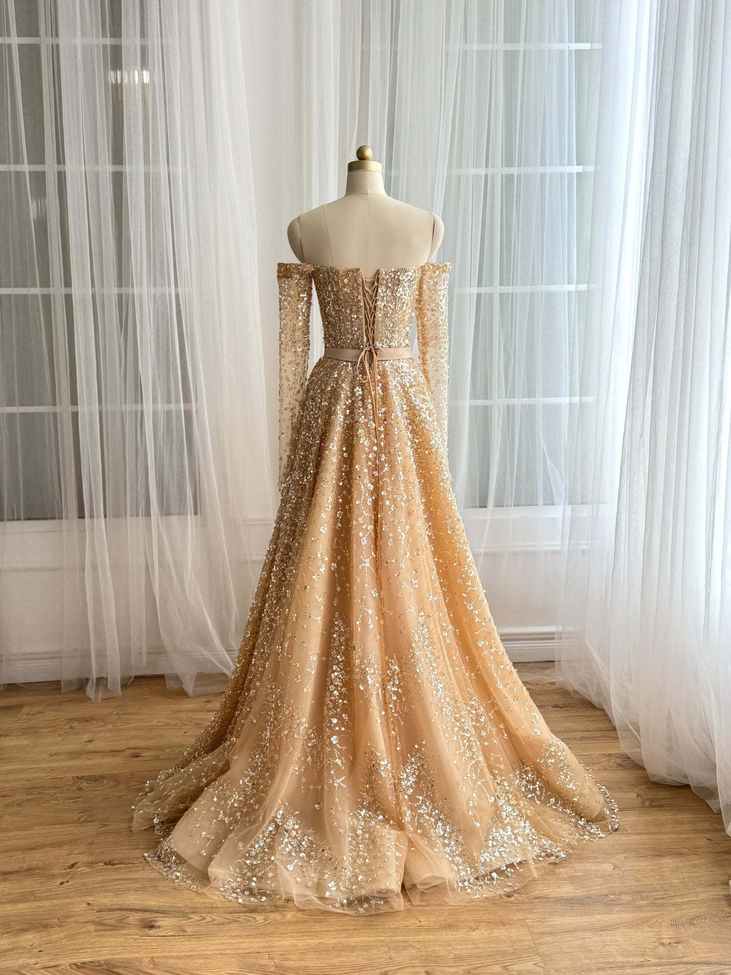 Beige A-Line dress with long off the shoulder sleeves and sequins