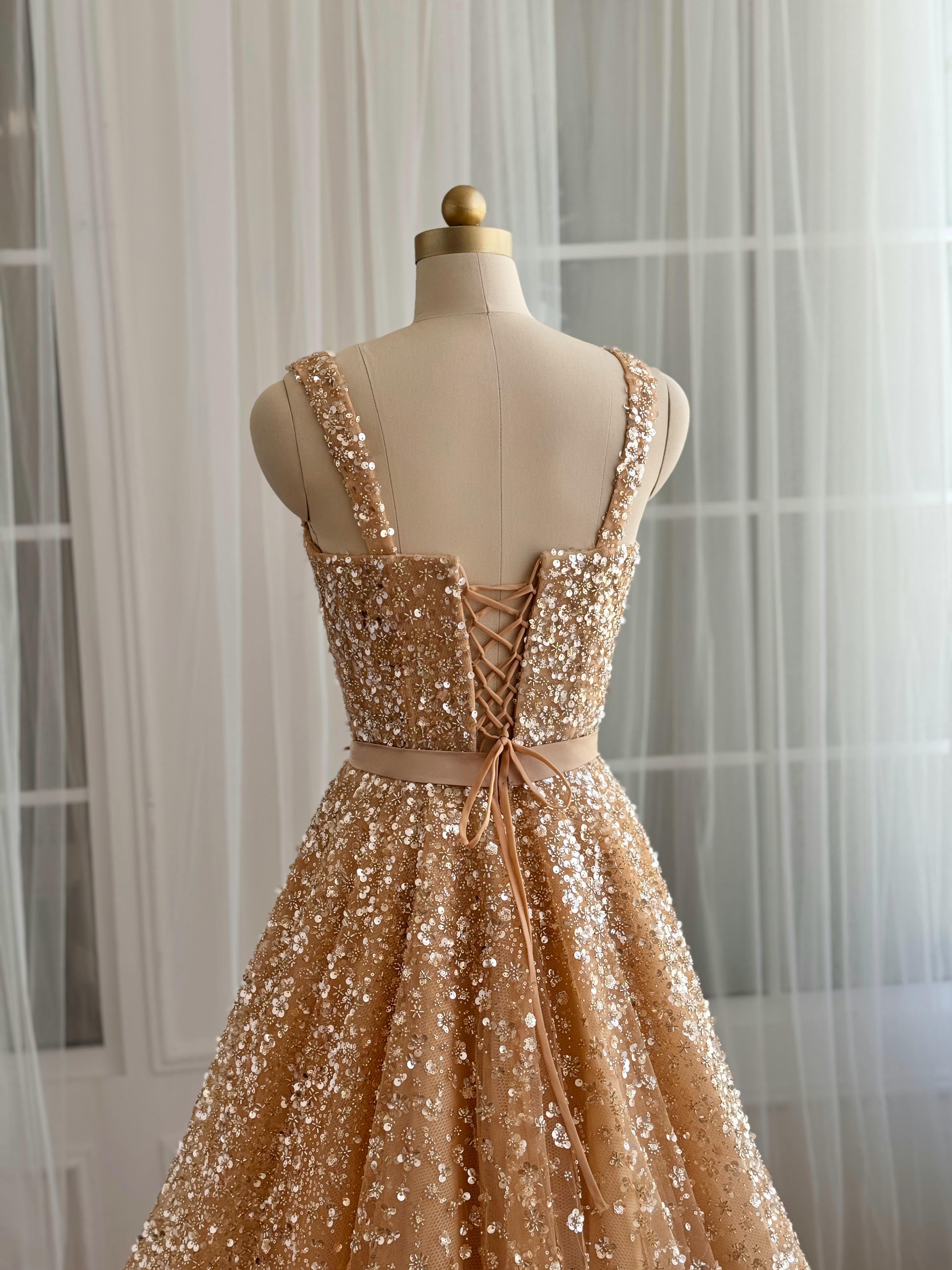 Beige A-Line gown with straps and gold sequins