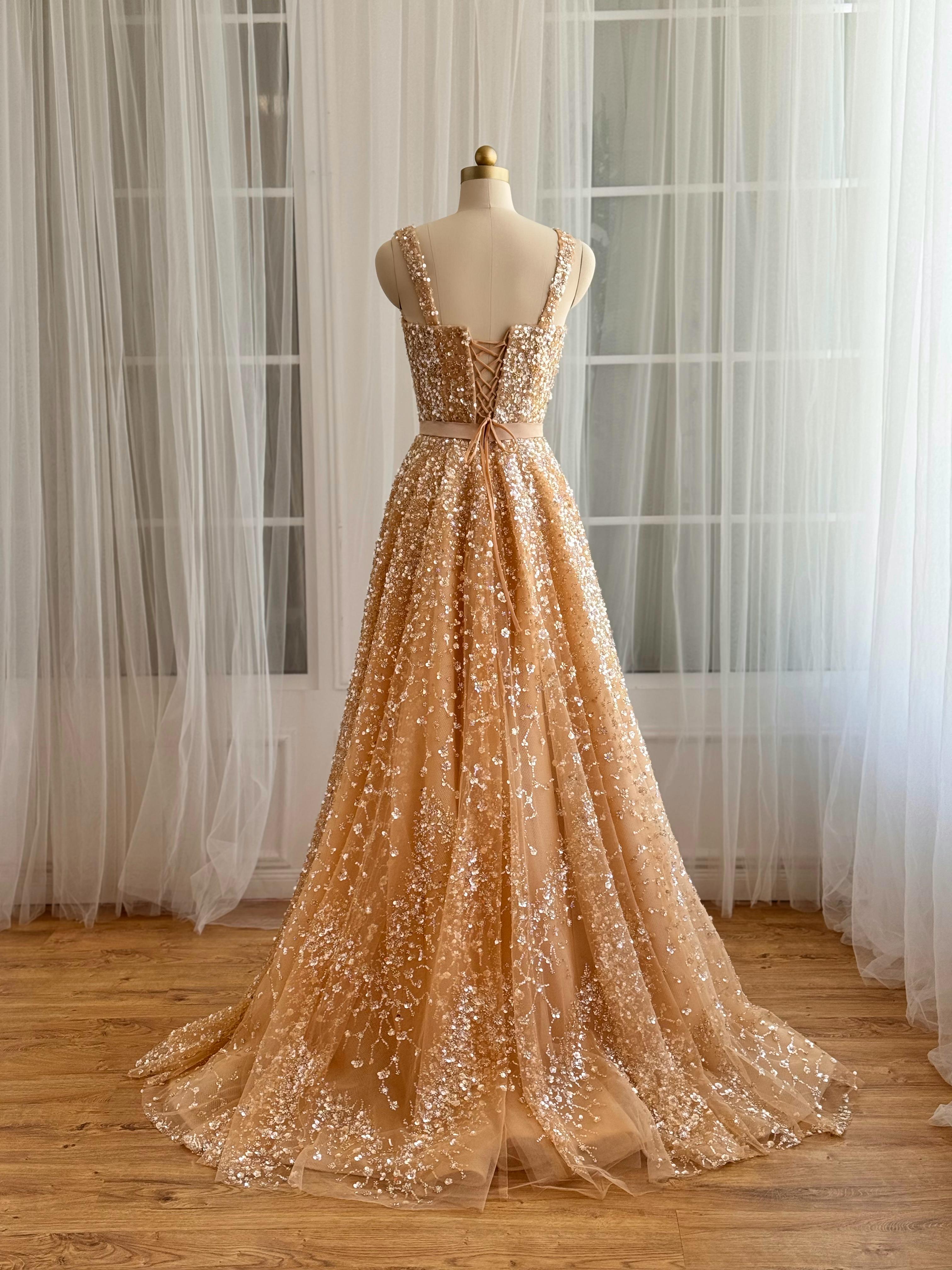 Beige A-Line gown with straps and gold sequins