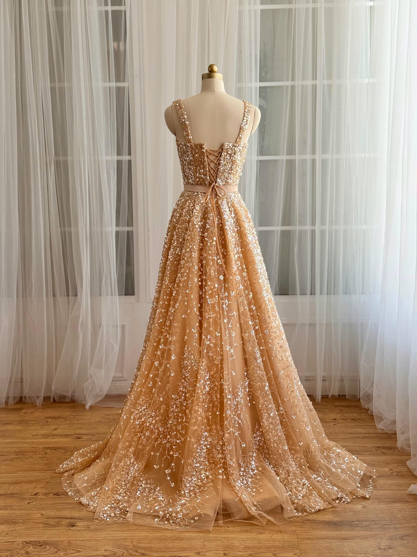Beige A-Line gown with straps and gold sequins
