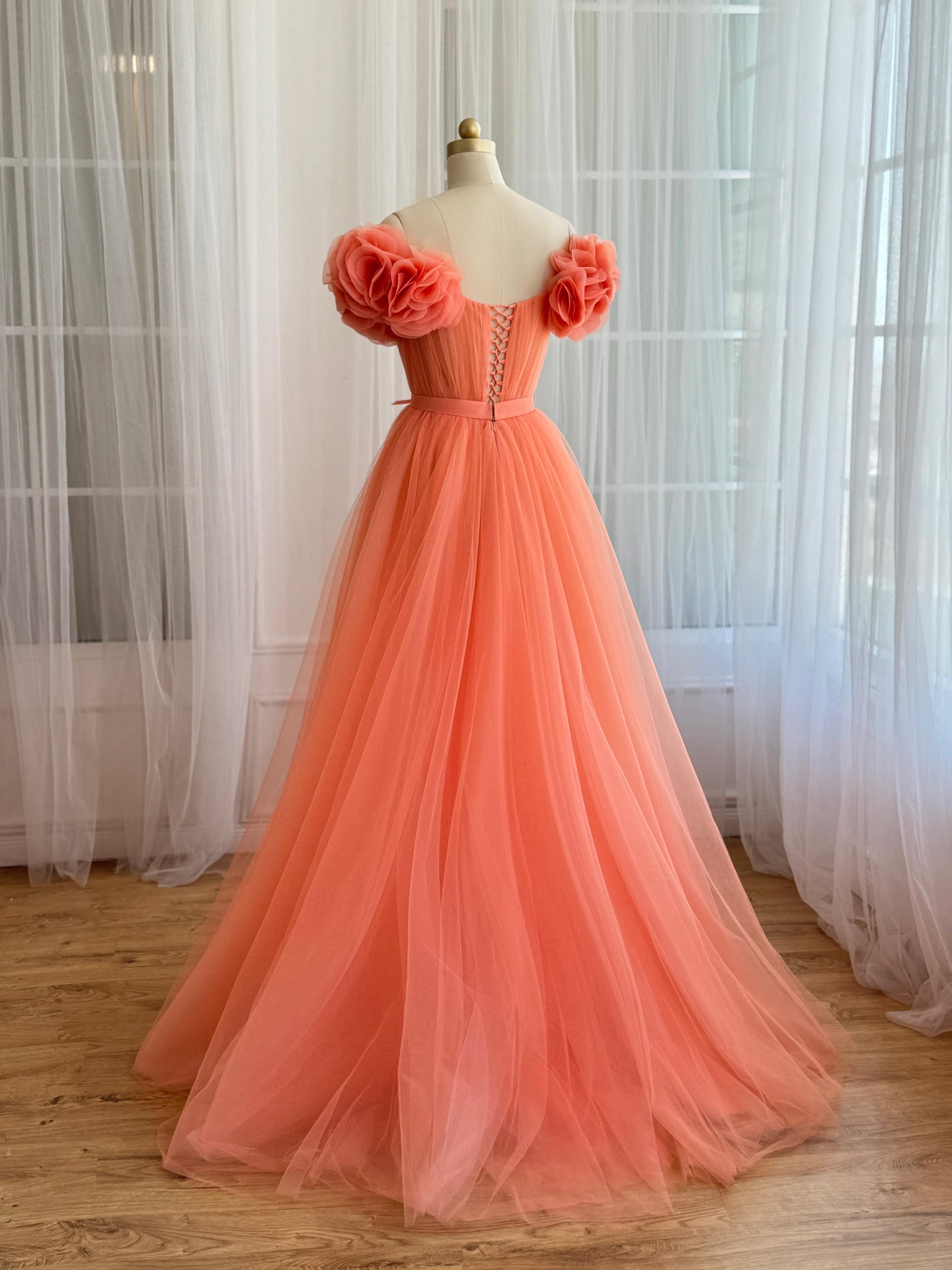 Peach A-Line gown with off the shoulder sleeves and embroidered flowers