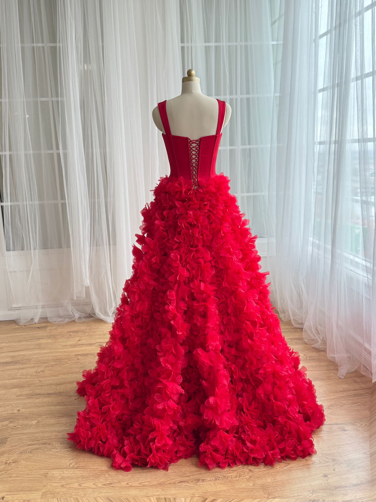 Red A-Line gown with straps and embroidered flowers
