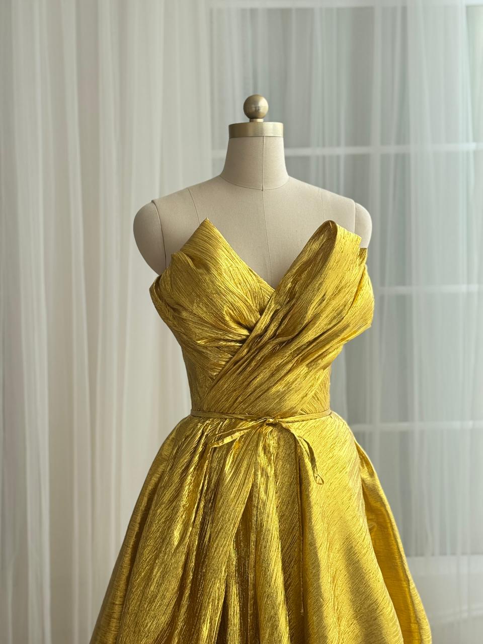 Yellow A-Line gown with no sleeves and v-neck