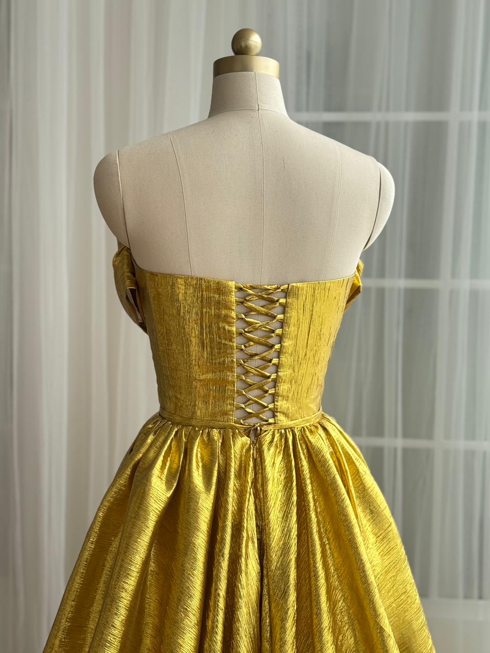 Yellow A-Line gown with no sleeves and v-neck