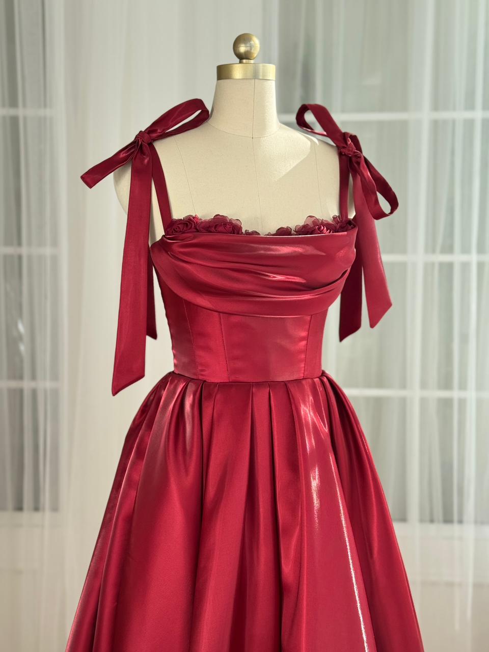 Red midi dress with bow straps and floral trim