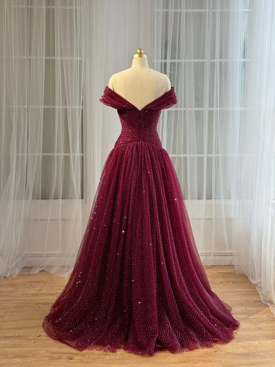 Red A-Line gown with off the shoulder sleeves and beading