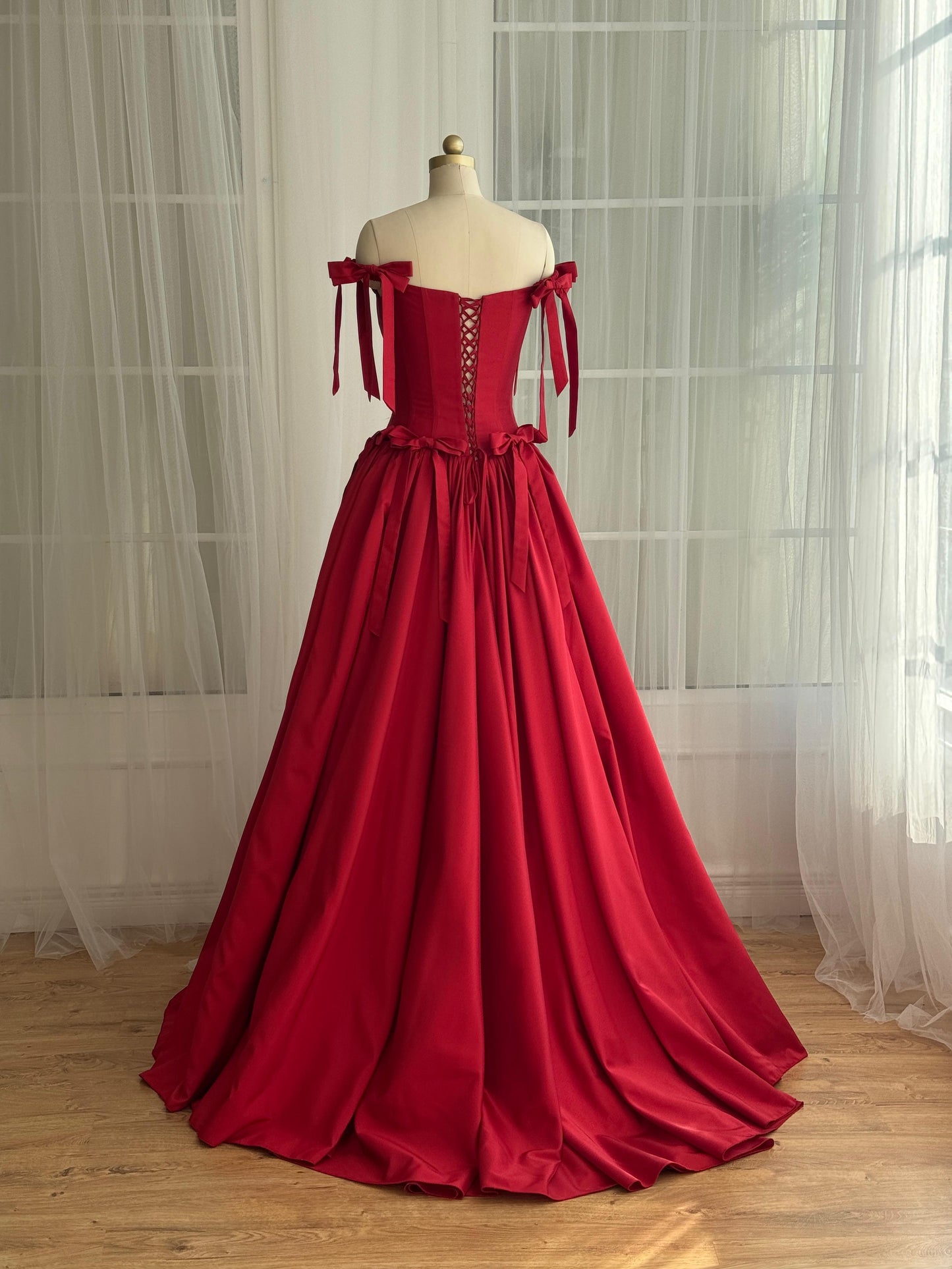 Red A-Line dress with off the shoulder sleeves and embroidered bows