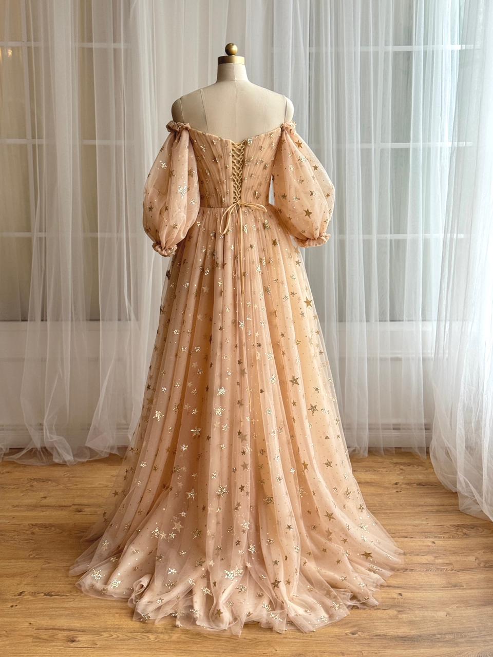 Gold A-Line dress with long off the shoulder sleeves, v-neck and starry tulle fabric