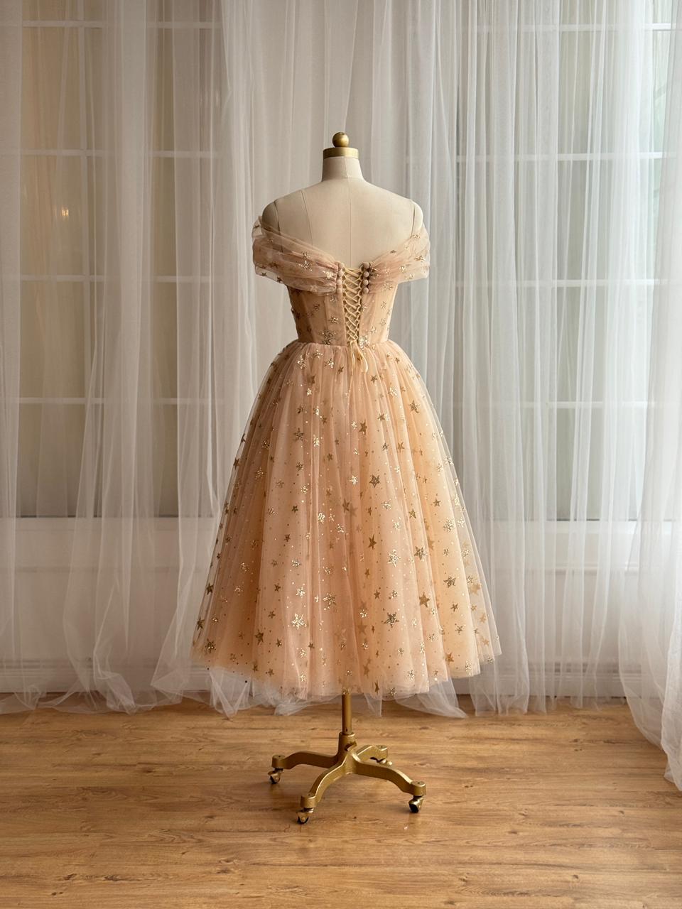 Gold midi dress with off the shoulder sleeves and starry tulle fabric