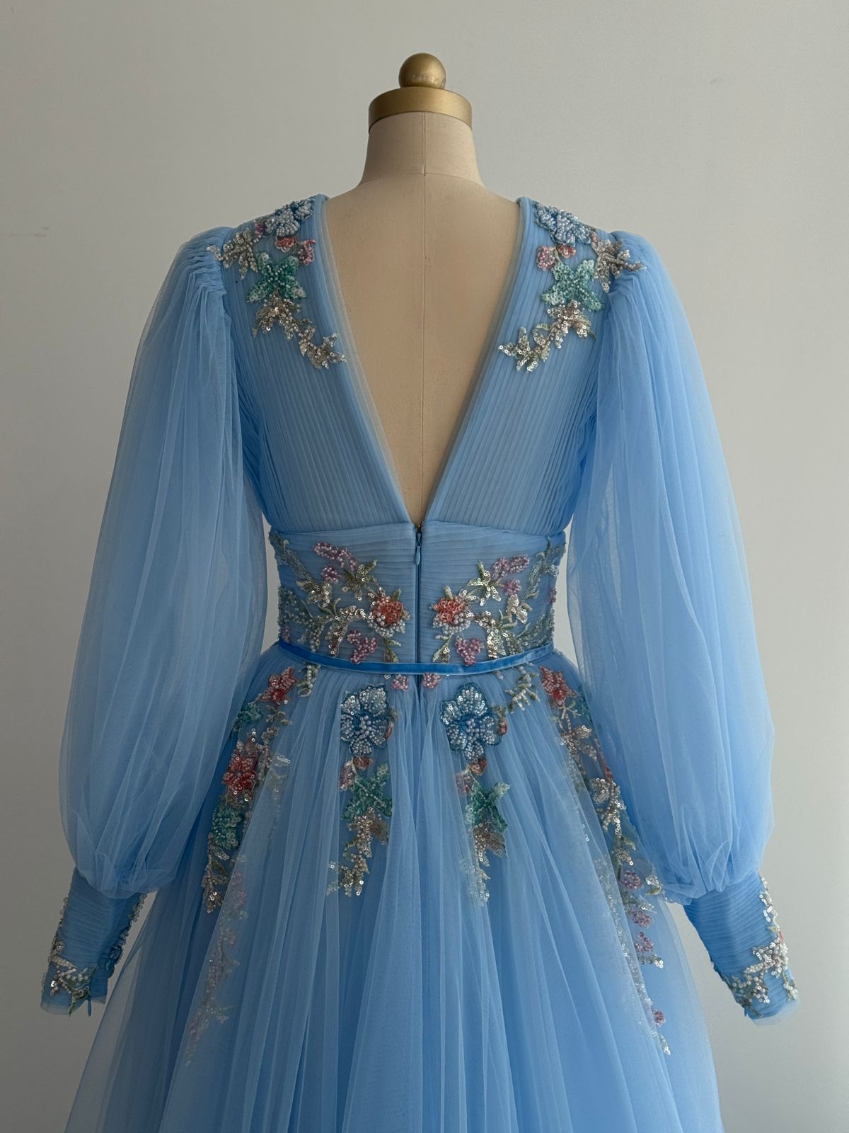 Blue A-Line gown with long sleeves, v-neck and embroidery