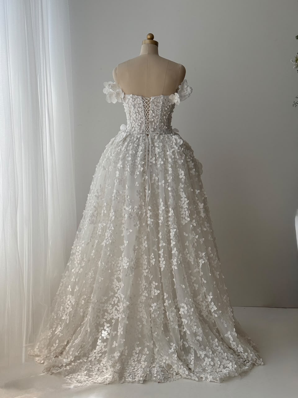 White A-Line bridal gown with off the shoulder sleeves, embroidery and detachable skirt