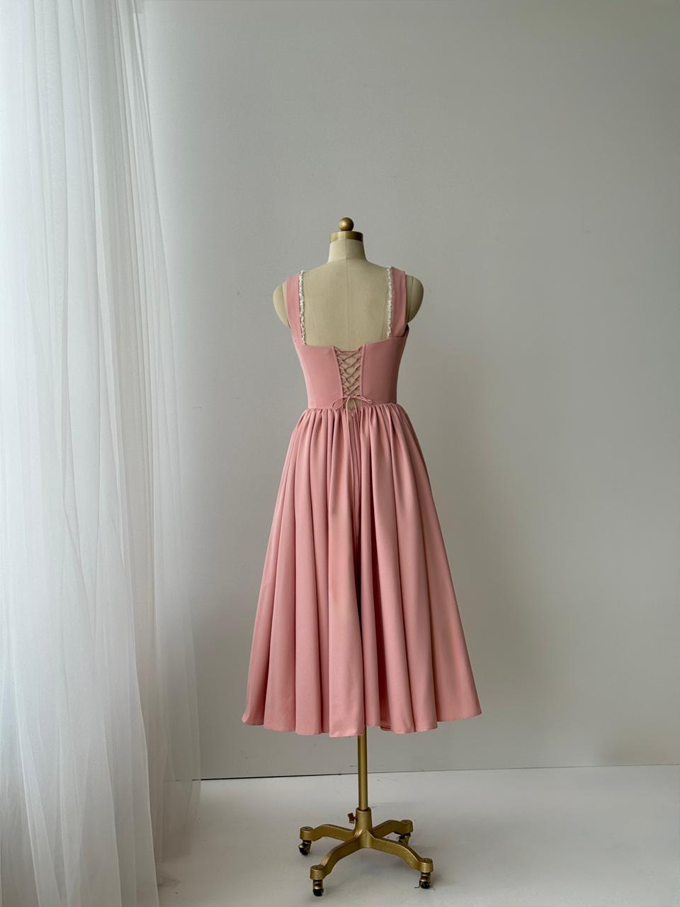 Pink midi dress with embroidered bows, lace and no sleeves