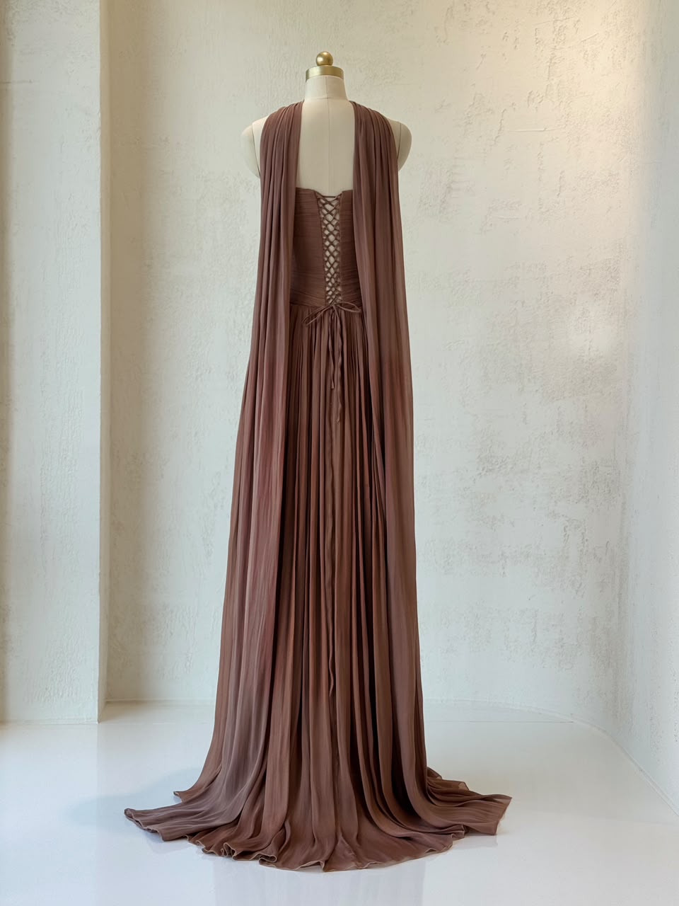 Brown A-Line gown, with draped fabric, cape and no sleeves