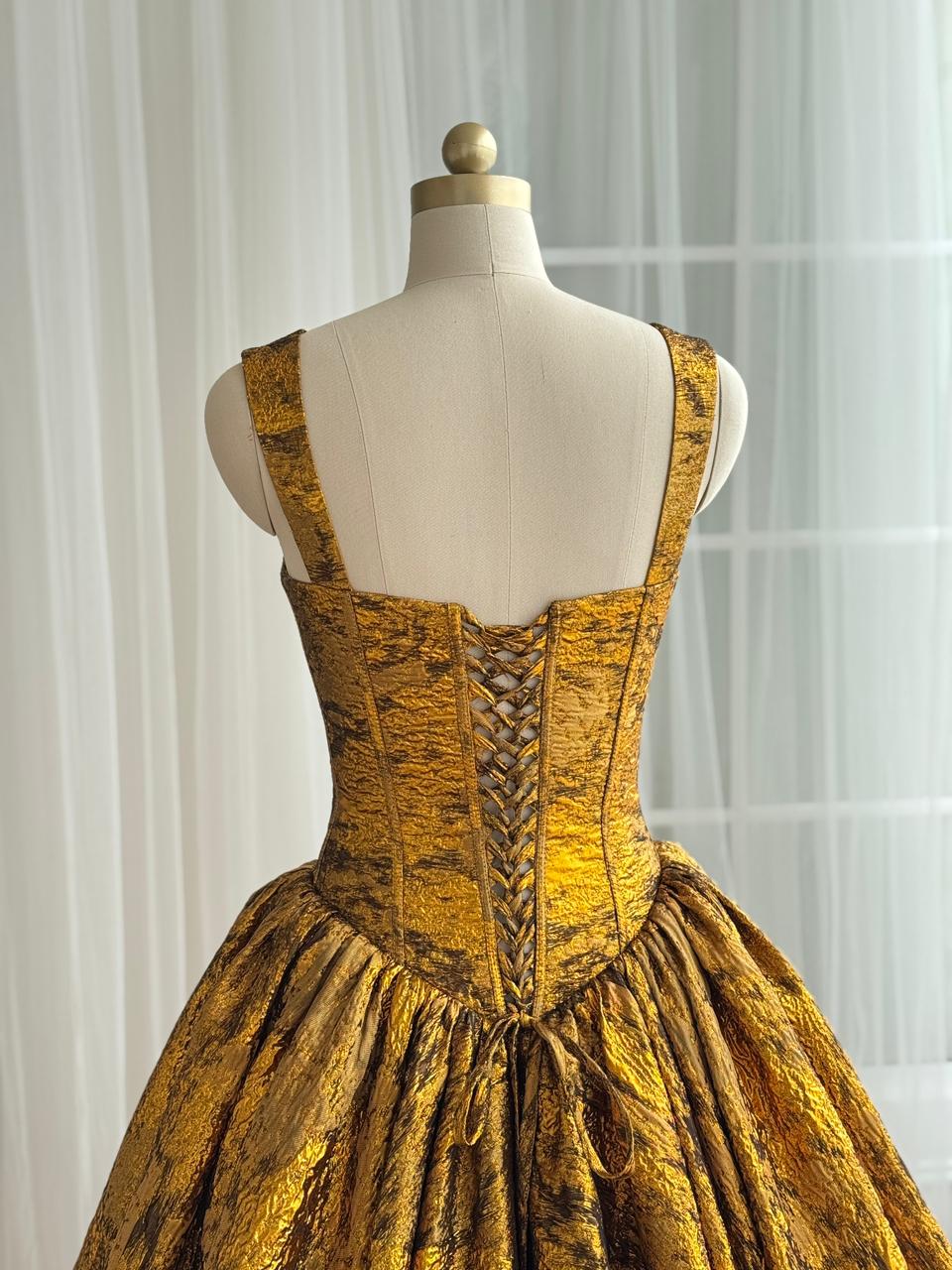 Gold A-Line gown with straps and brocade fabric