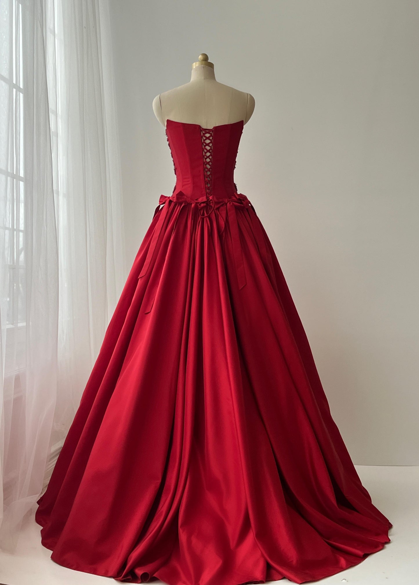 Red A-Line dress with embroidery, bows and no sleeves